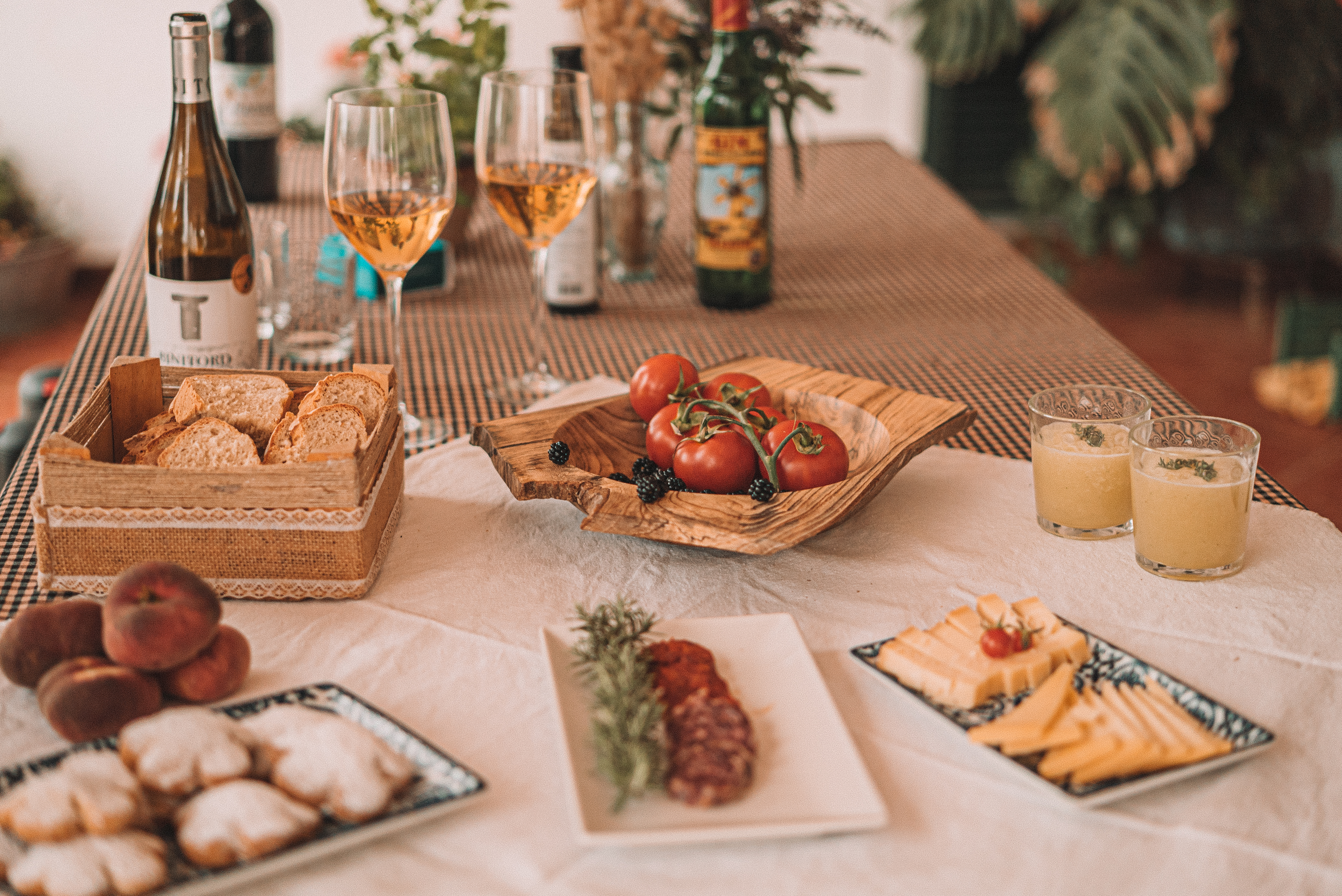 a table with food and wine glasses