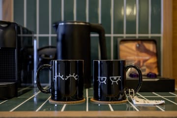 a black mugs on a counter