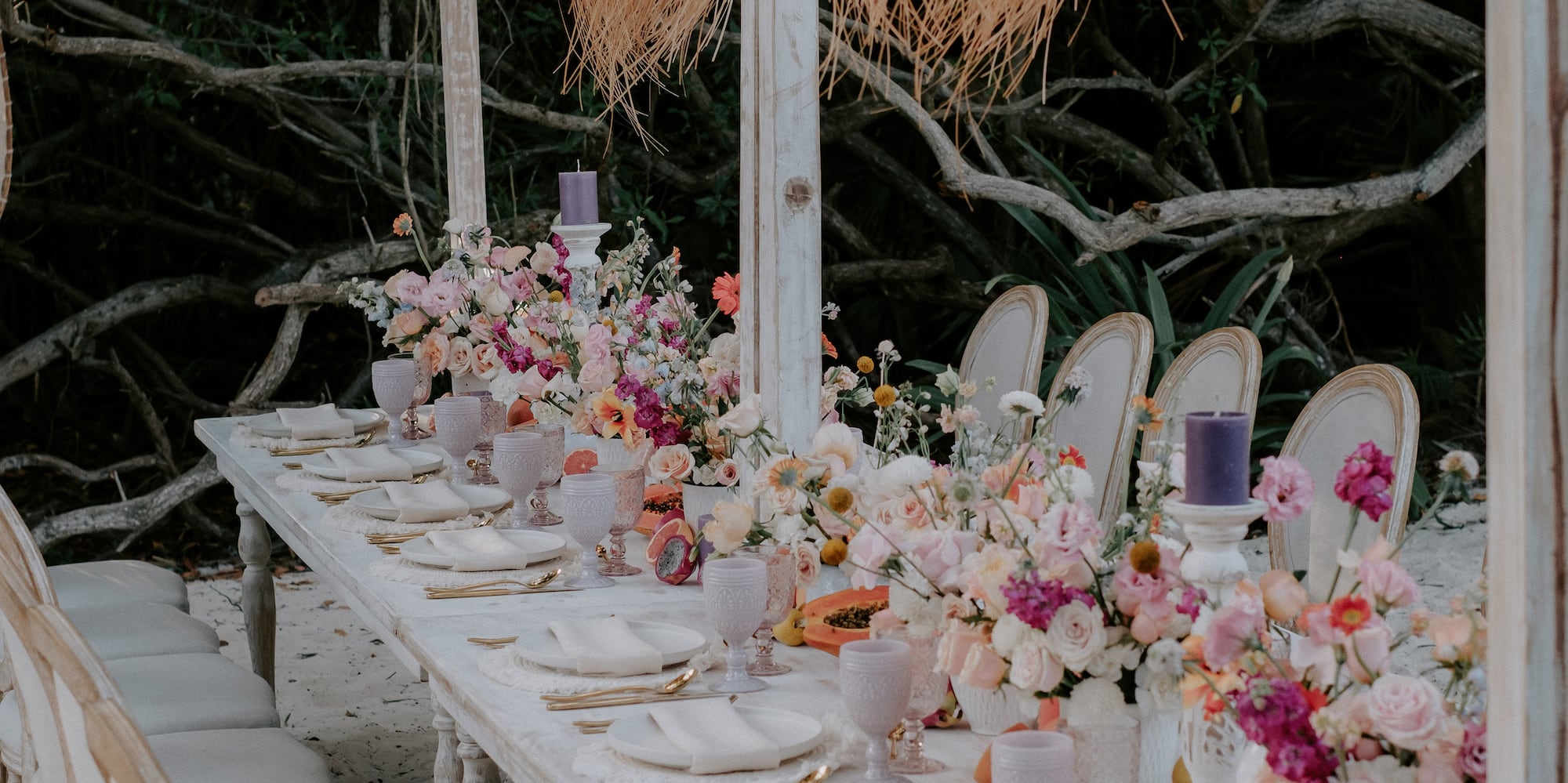 a table with flowers and chairs