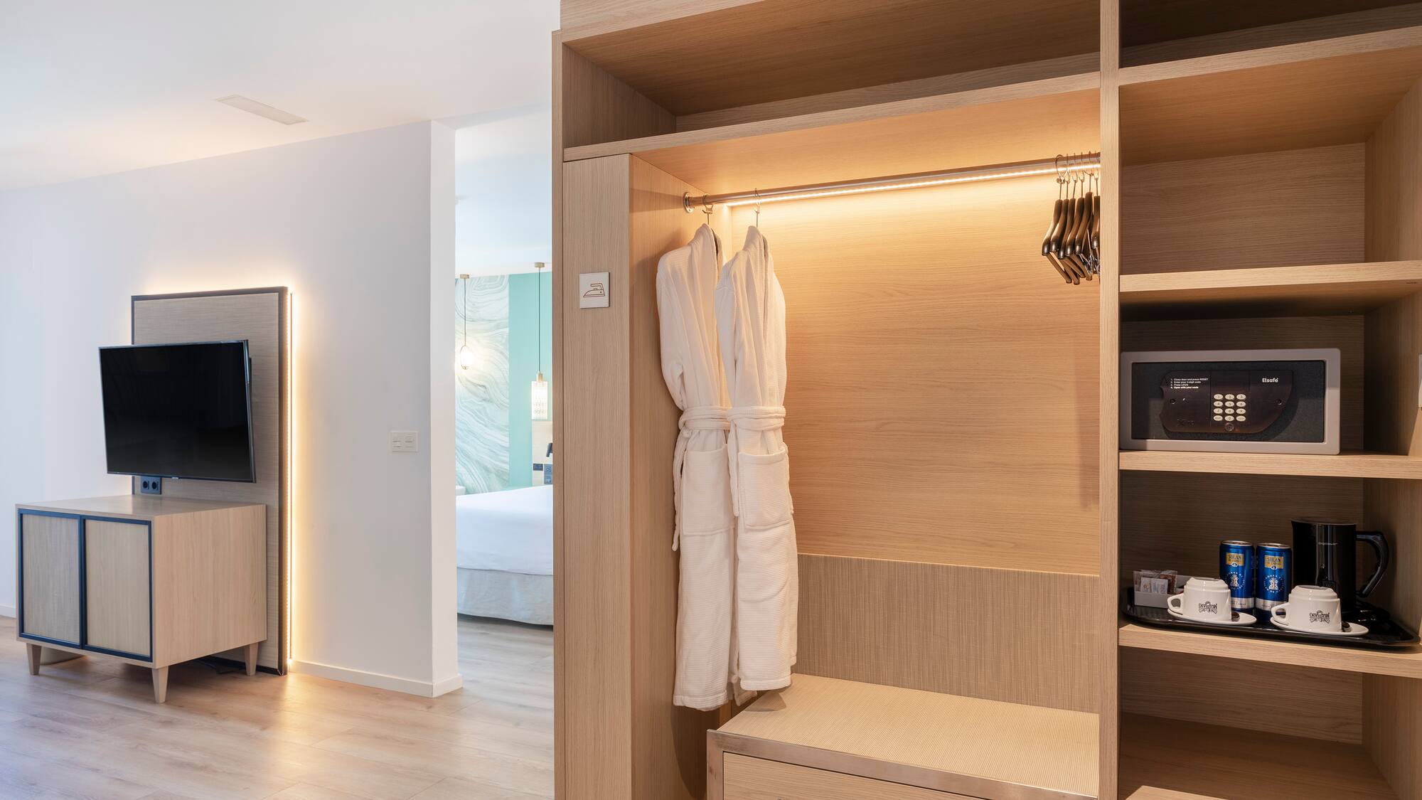 a room with a closet and a tv