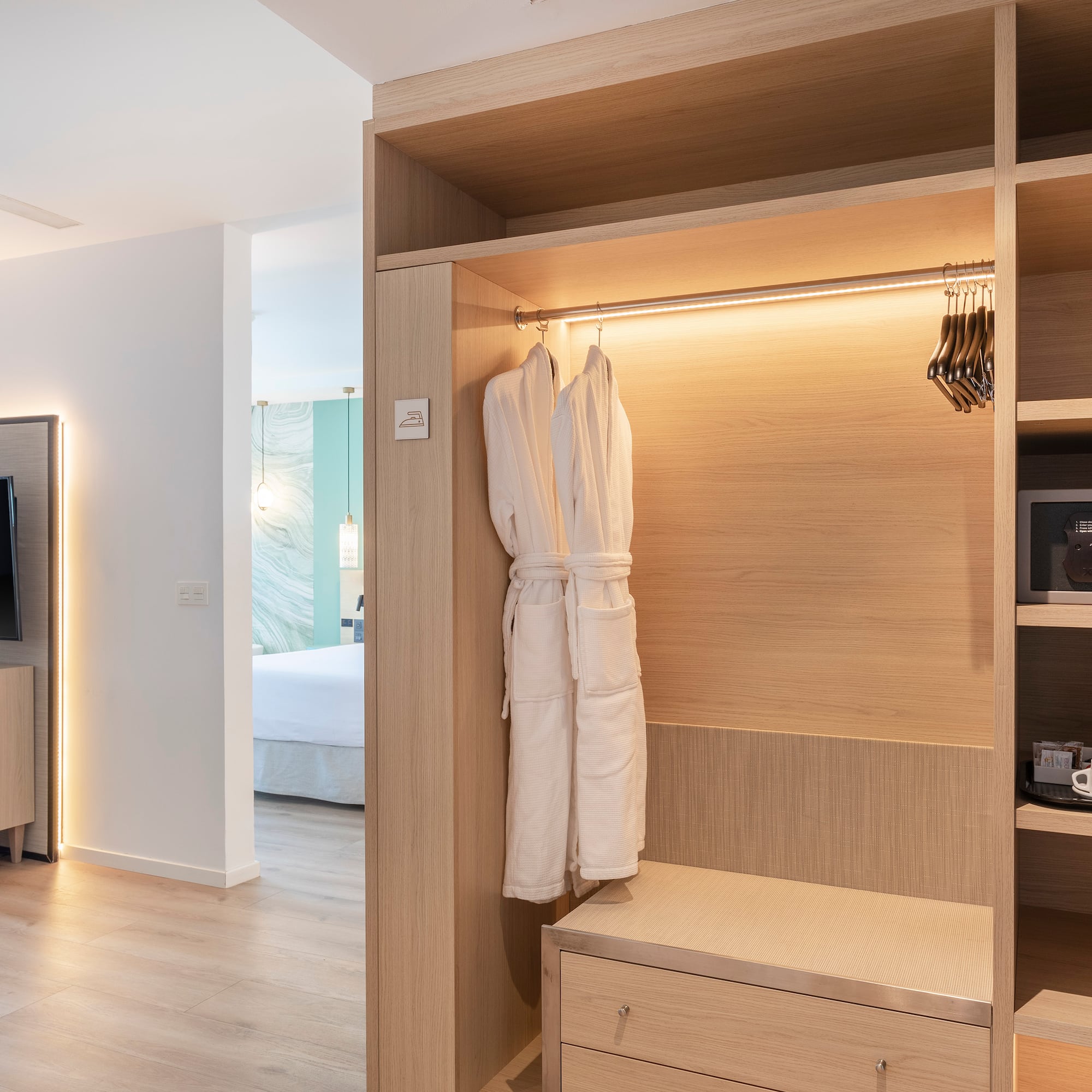 a room with a closet and a tv