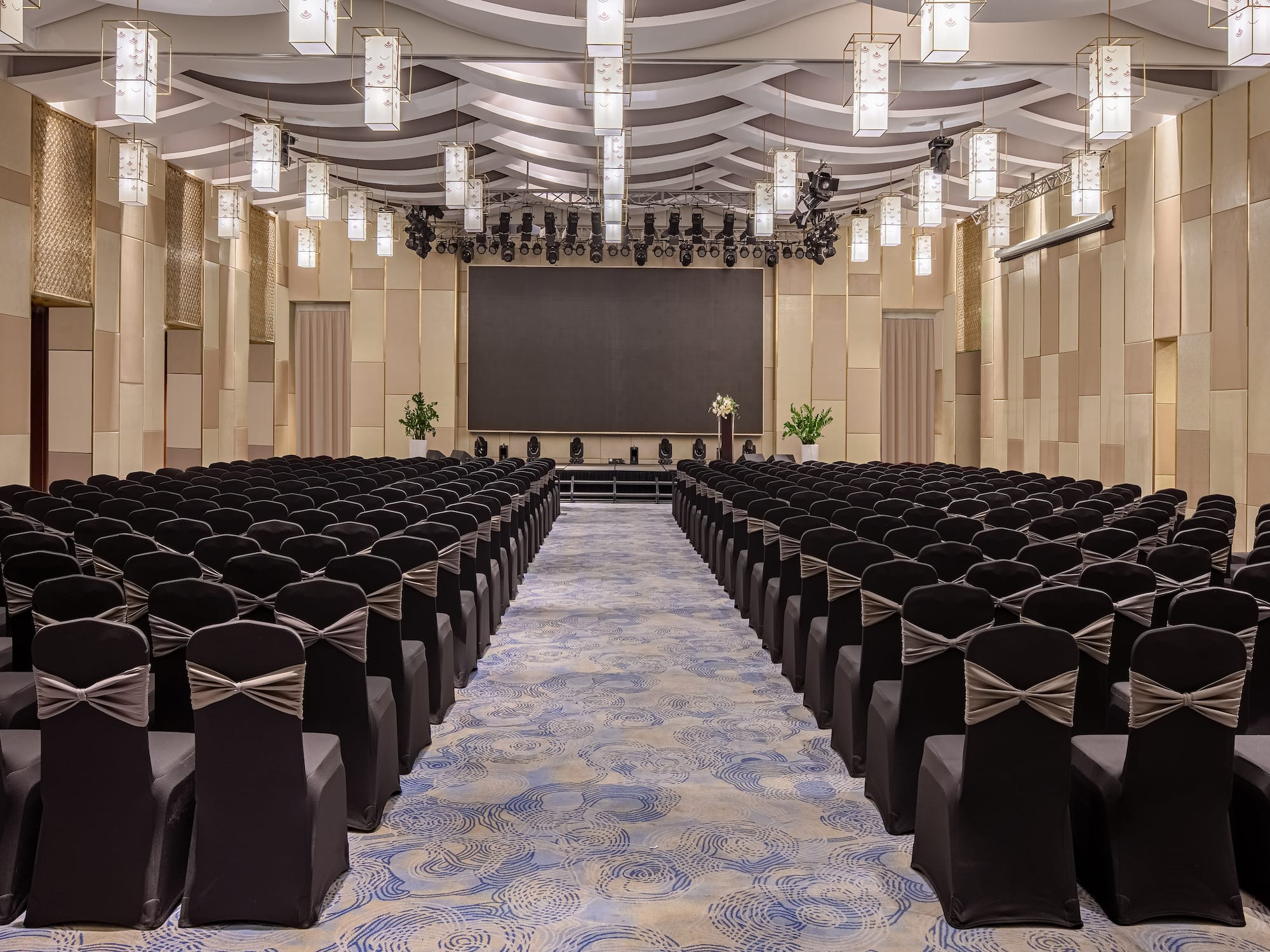 a room with chairs and a screen