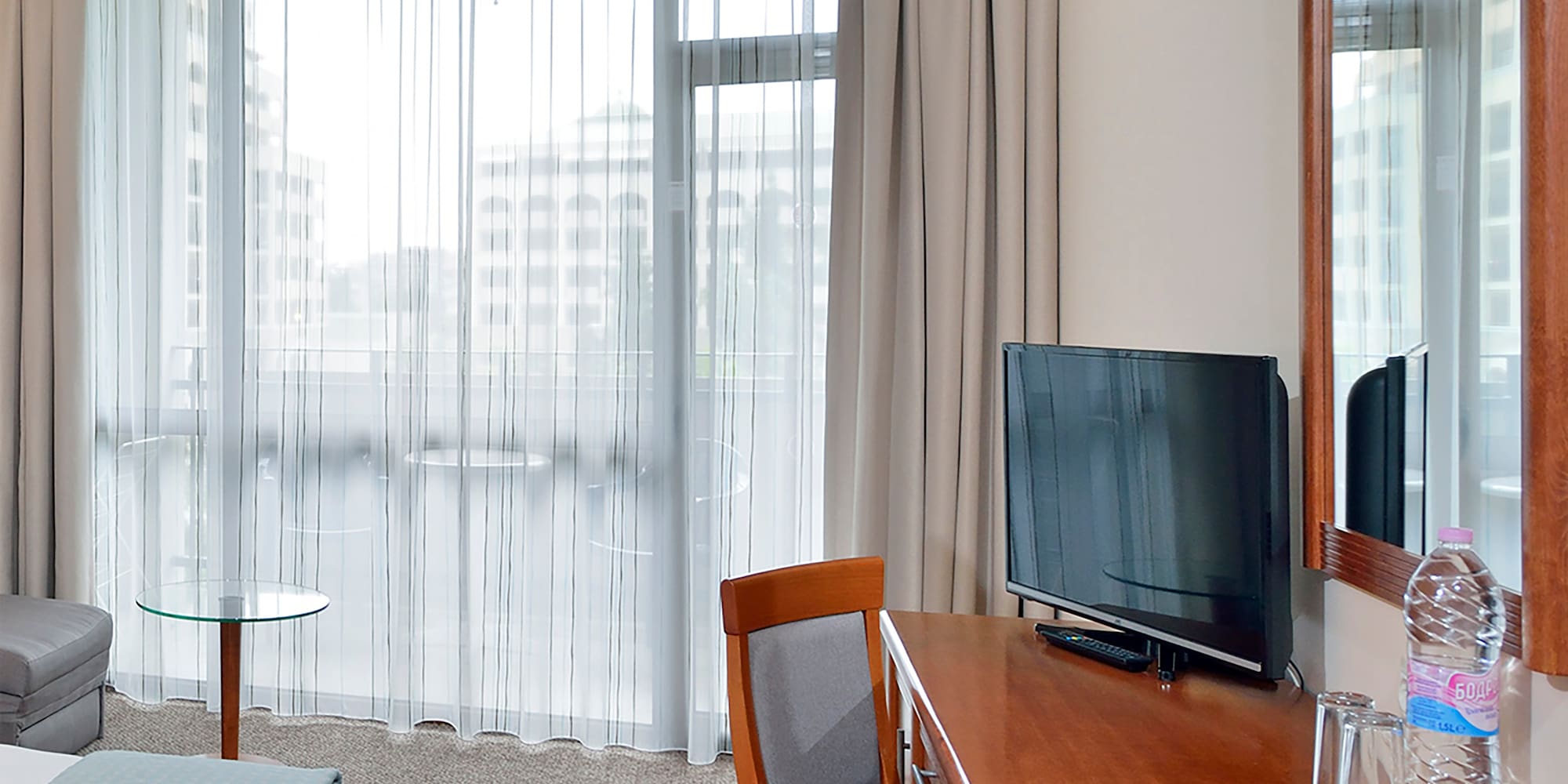 a room with a desk and a bed