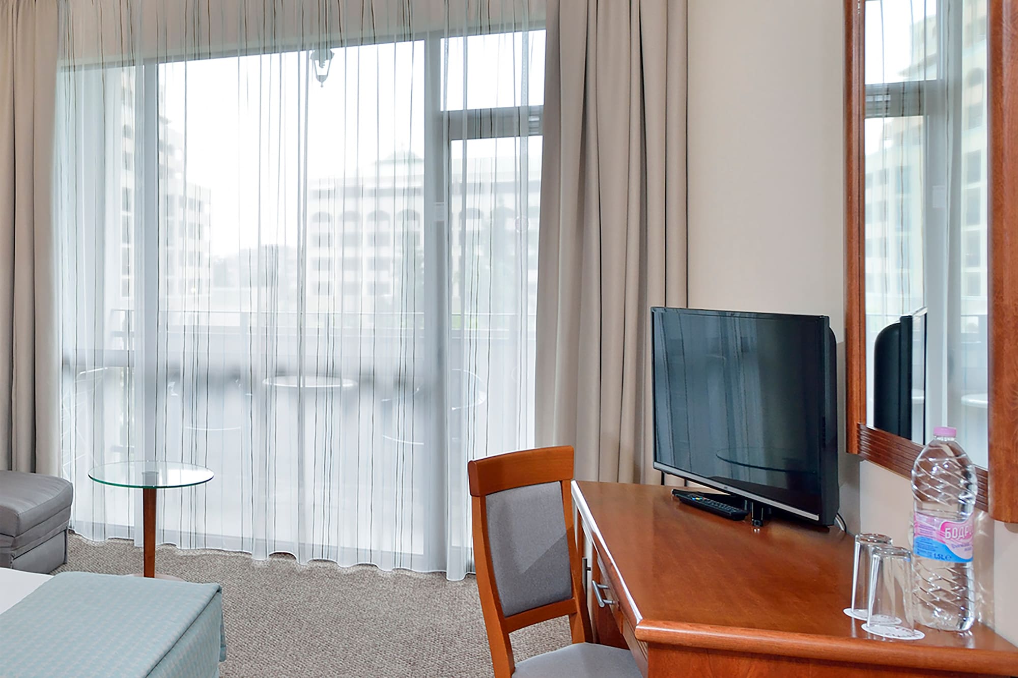 a room with a desk and a bed