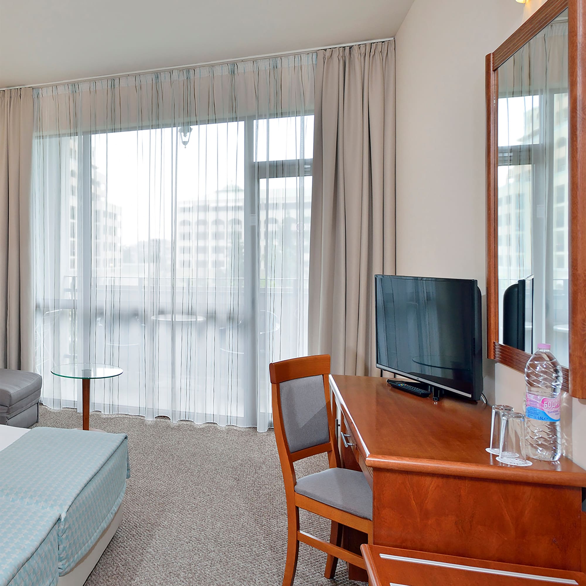 a room with a desk and a bed