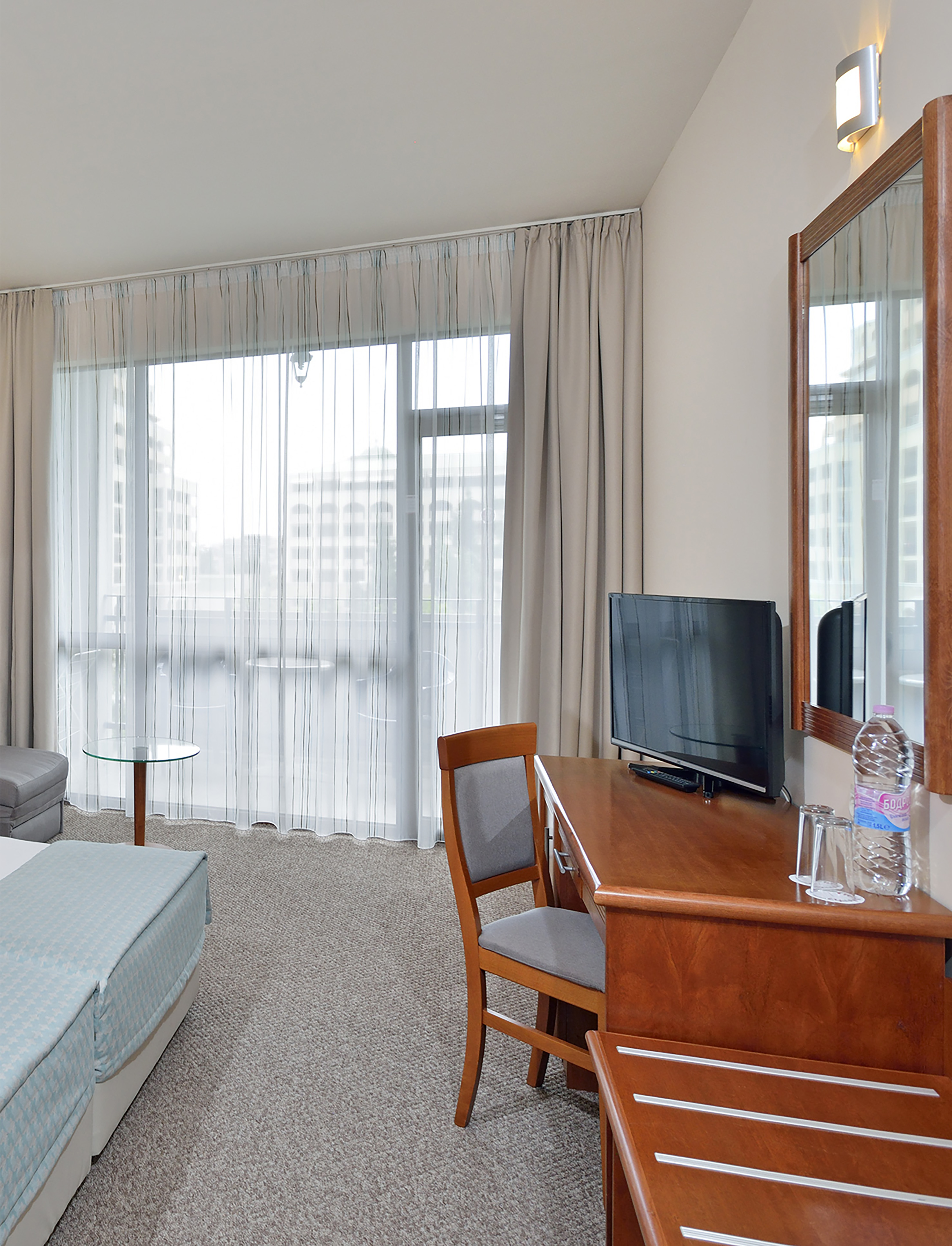 a room with a desk and a bed