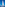 White sailing yacht on deep blue ocean with clear blue sky.