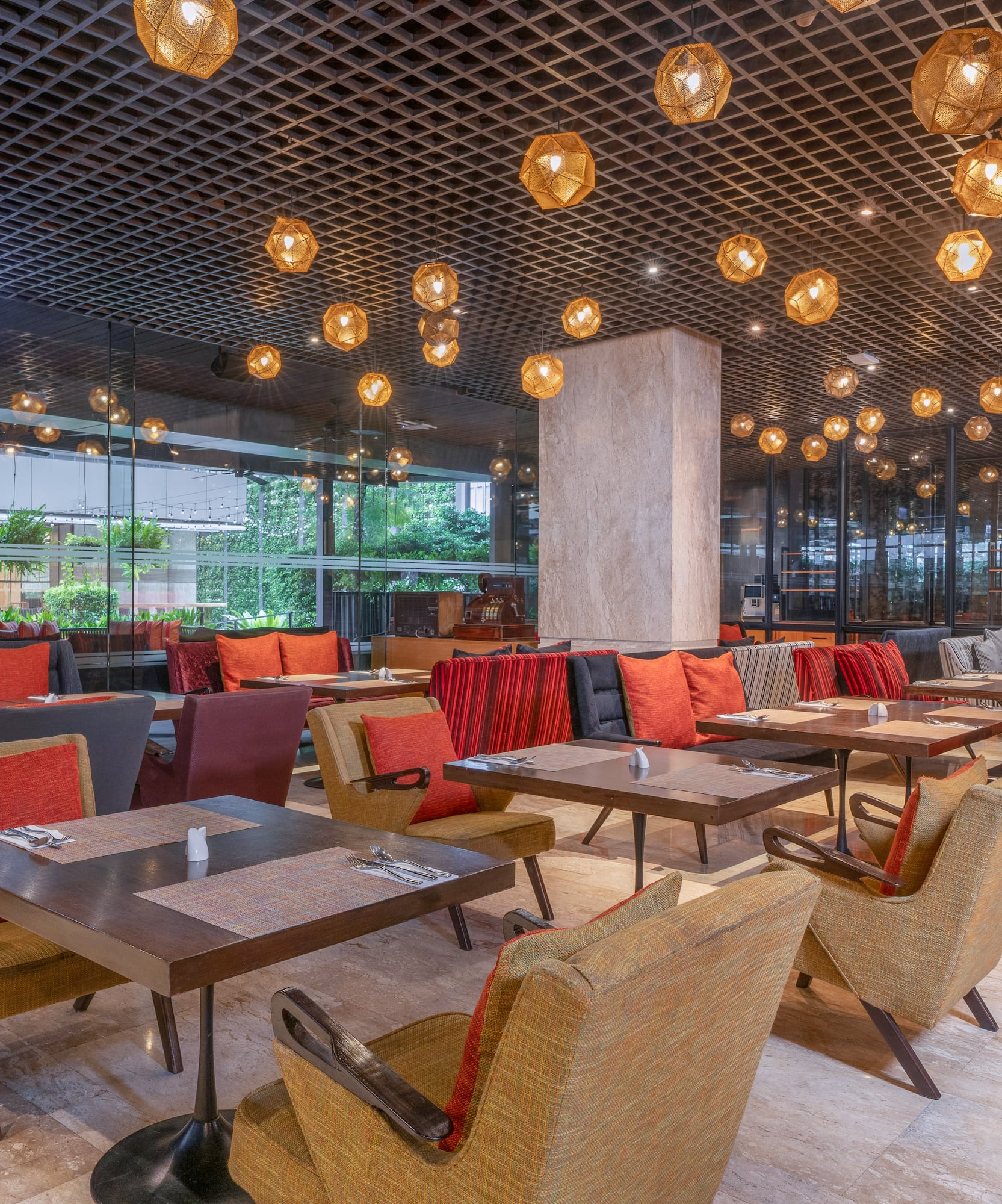Modern restaurant interior with chic armchairs, dark wood tables, and a grid ceiling with pendant lights. - Dee Lite Bistro, International cuisine - The Hotel Bangkok Sukhumvit 26 Affiliated by Meliá, Bangkok
