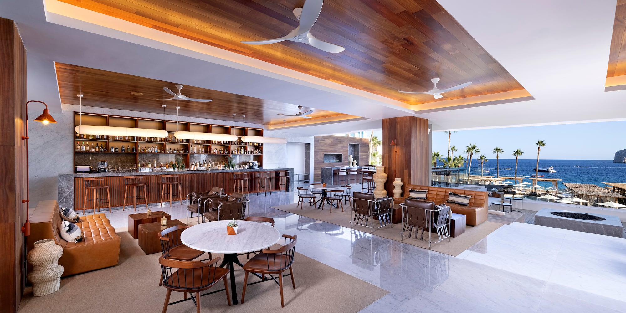 a room with a bar and tables