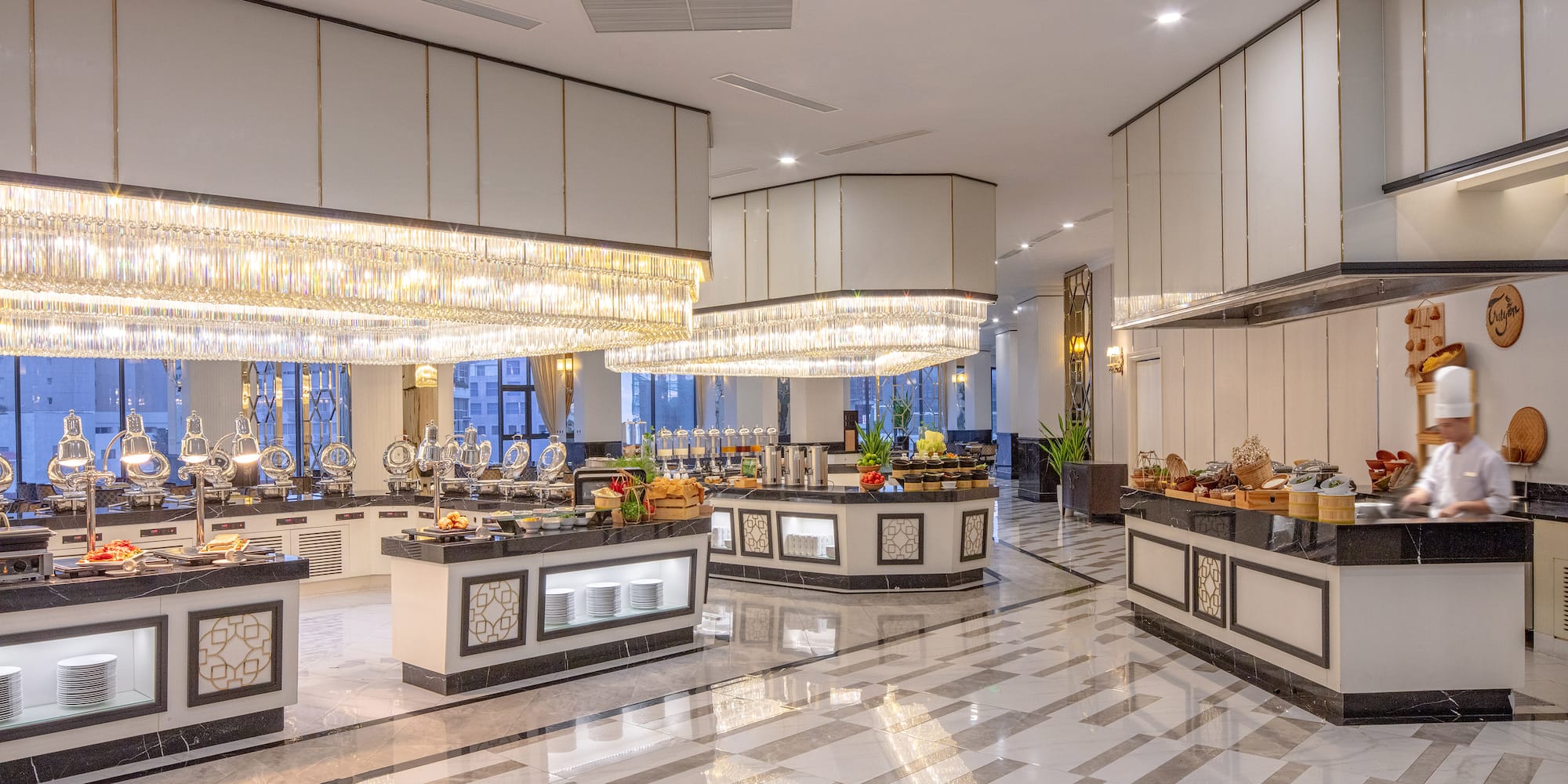 a large room with a buffet and chandeliers