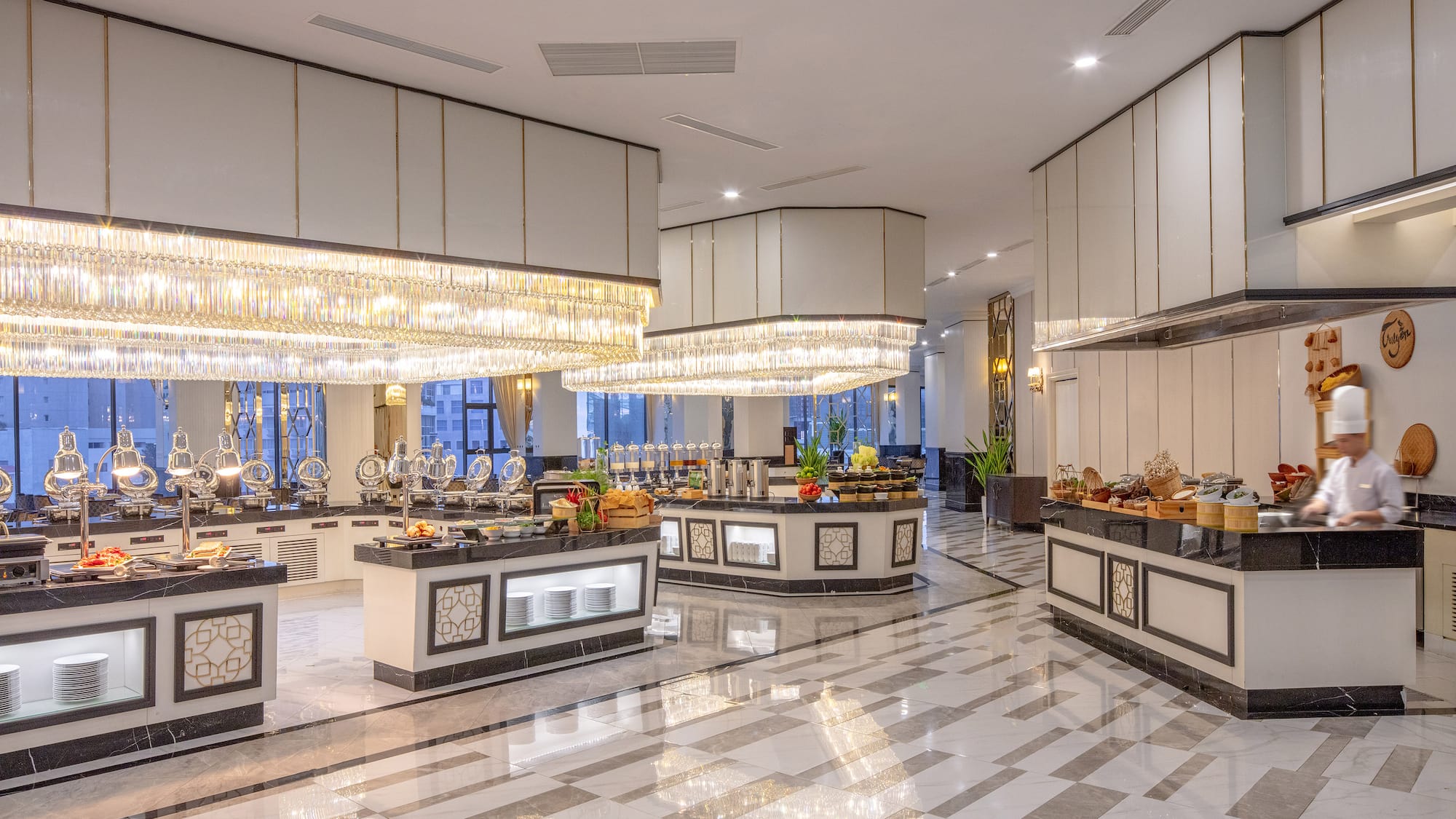 a large room with a buffet and chandeliers