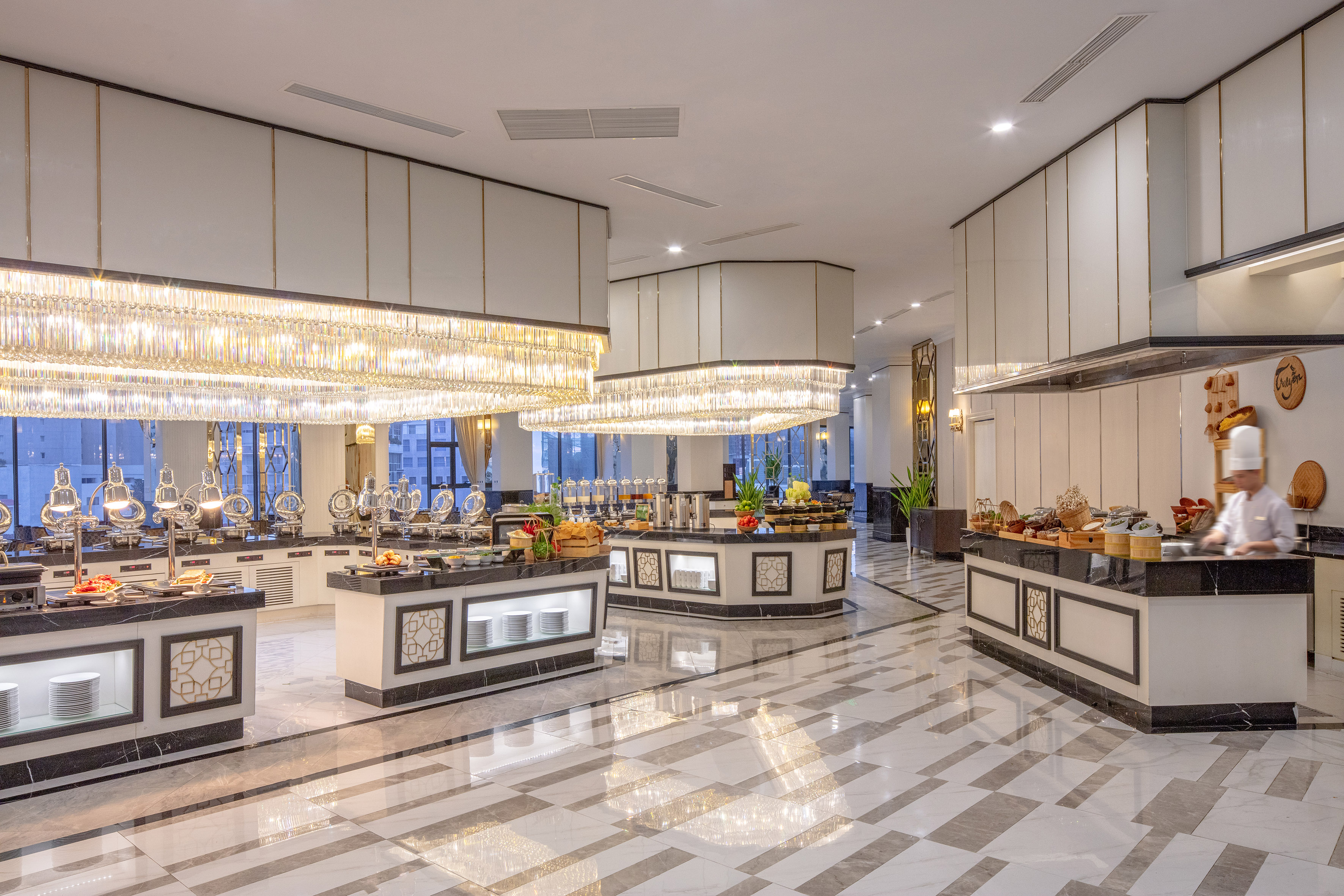 a large room with a buffet and chandeliers