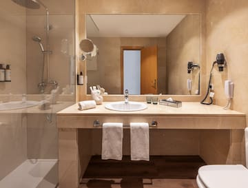 a bathroom with a mirror and sink