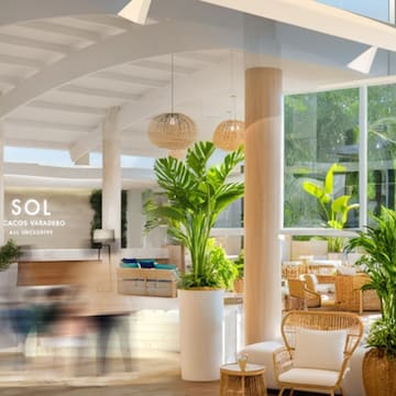 a room with a large white ceiling and plants