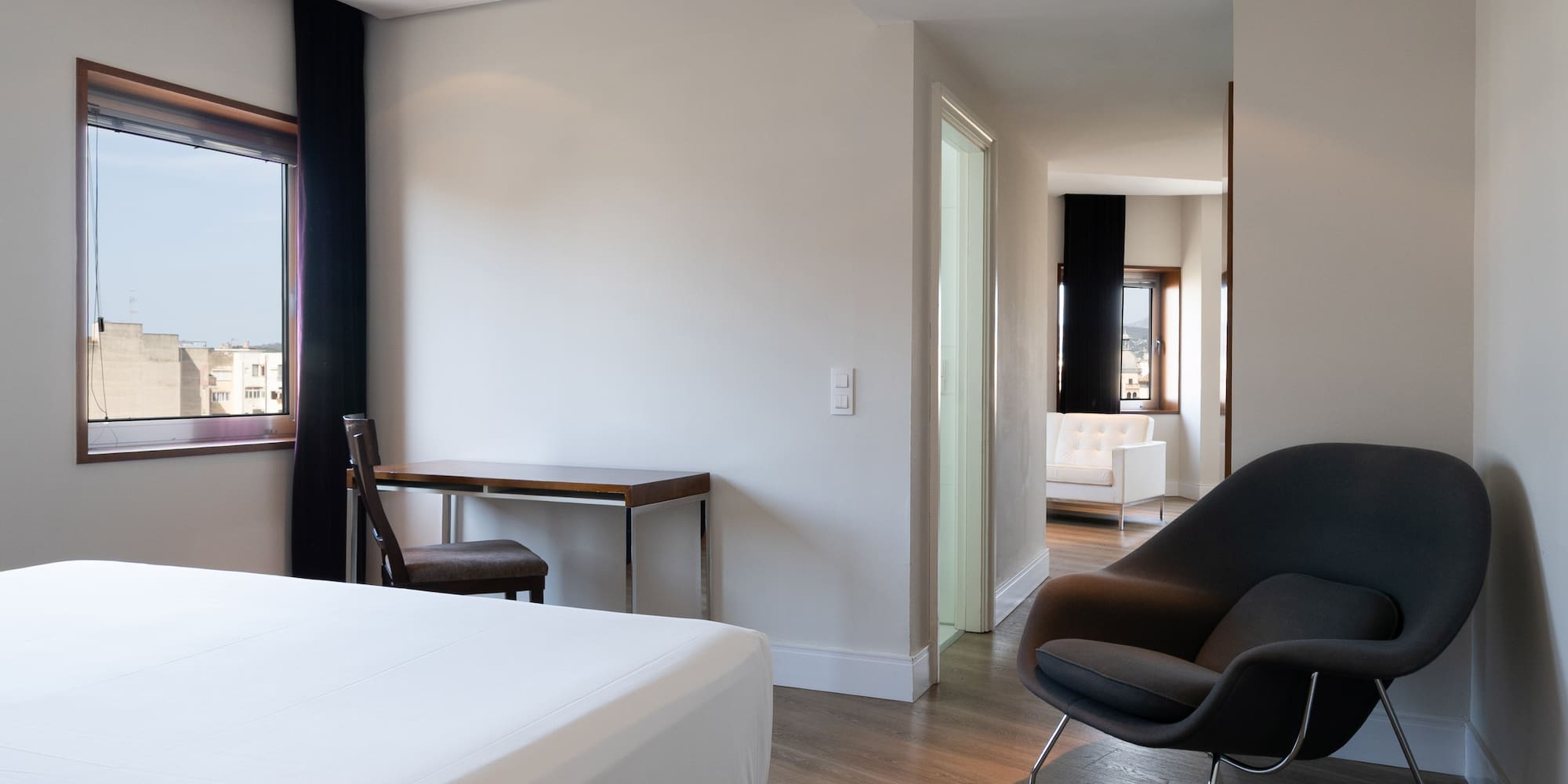 a room with a bed and a chair