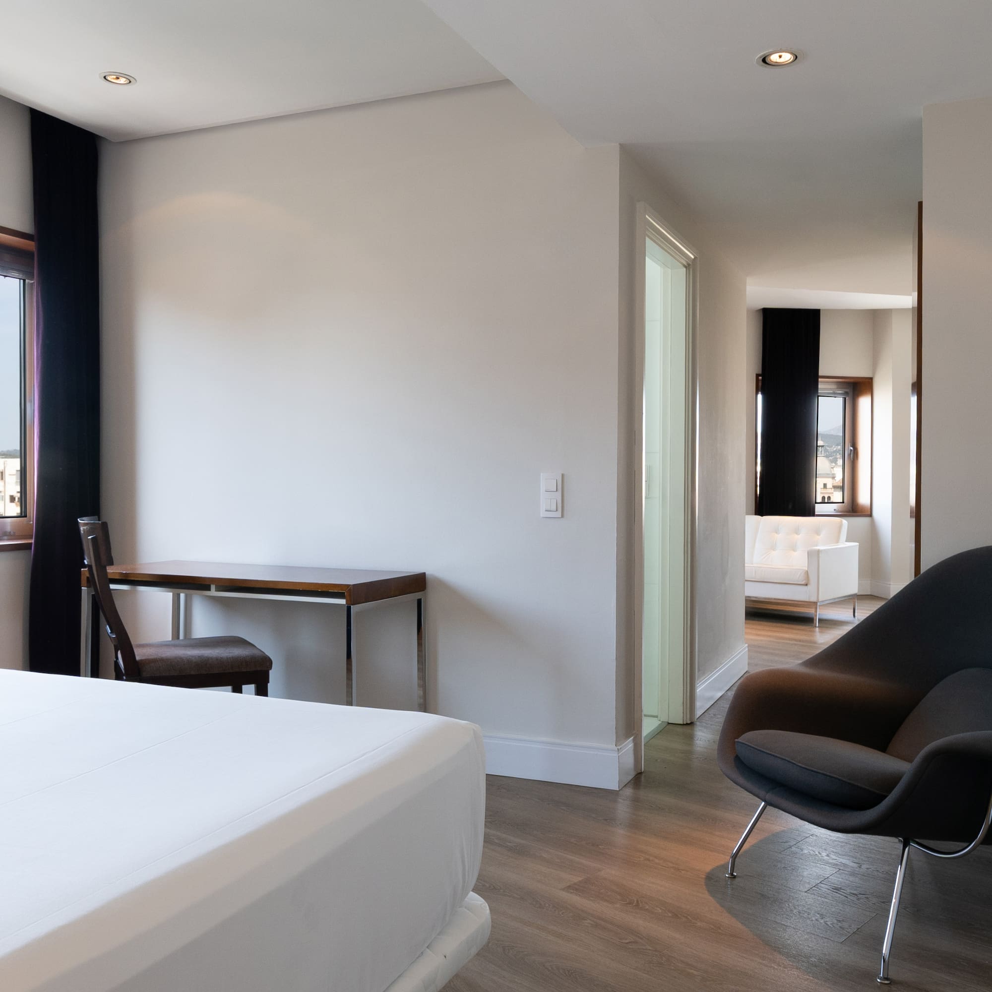 a room with a bed and a chair