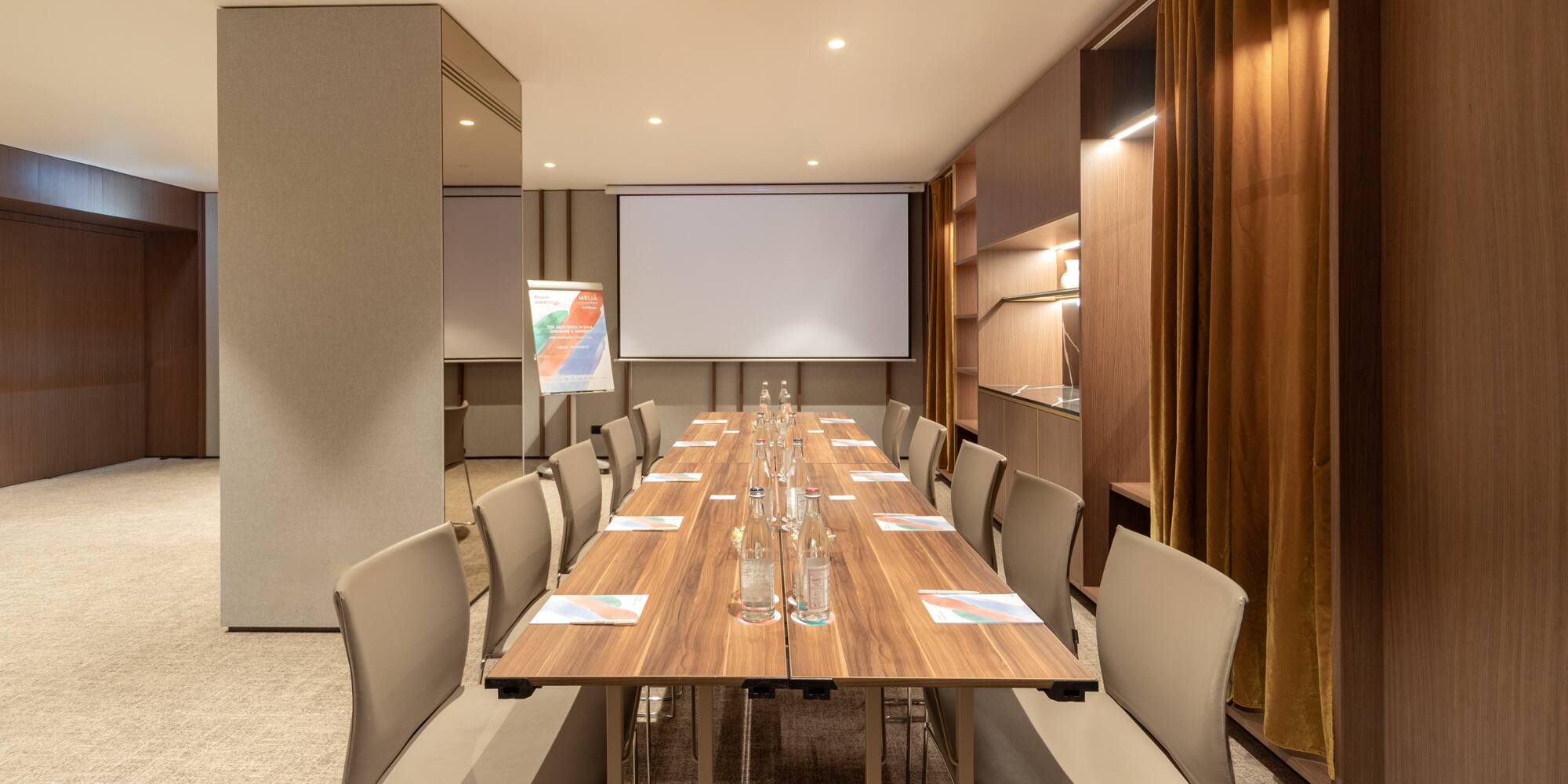 a conference room with a table and chairs