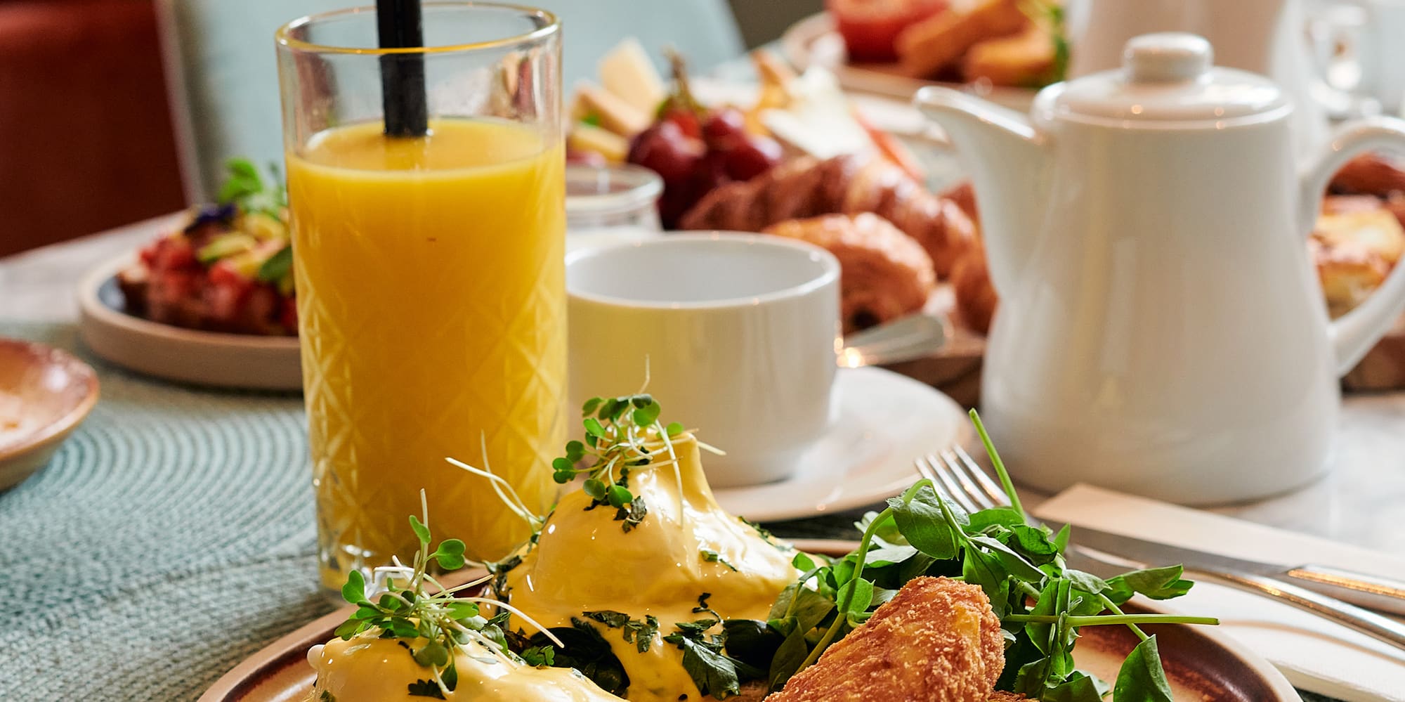 a plate of food and a drink on a table