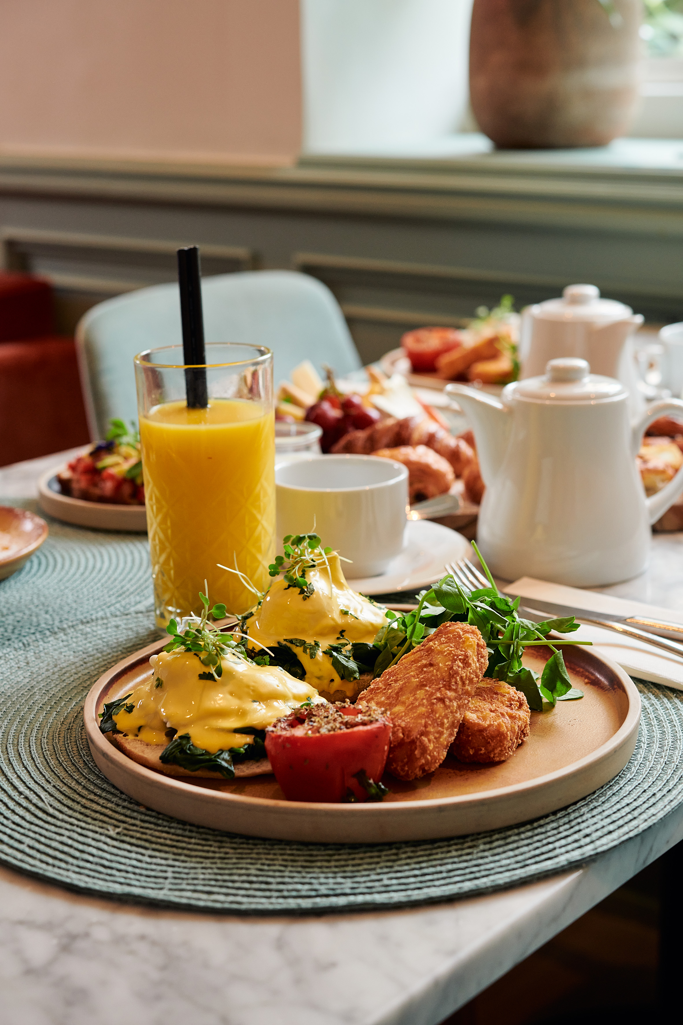 a plate of food and a drink on a table