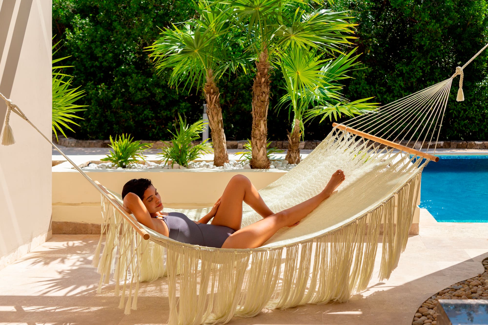 a woman lying in a hammock