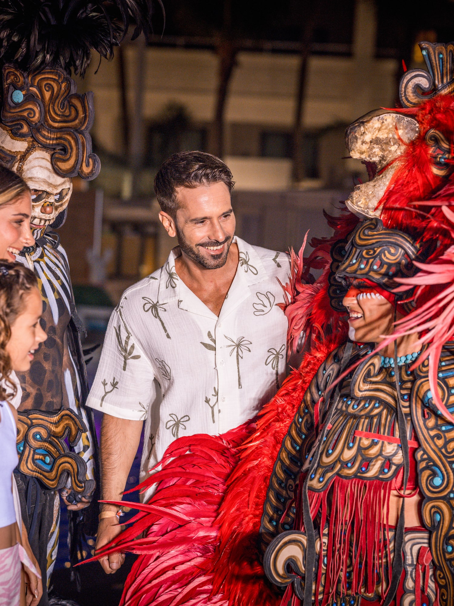 a group of people standing around a garmentd person