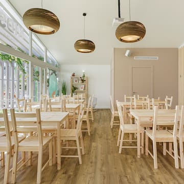 a room with tables and chairs