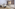 a living room with a couch and chairs