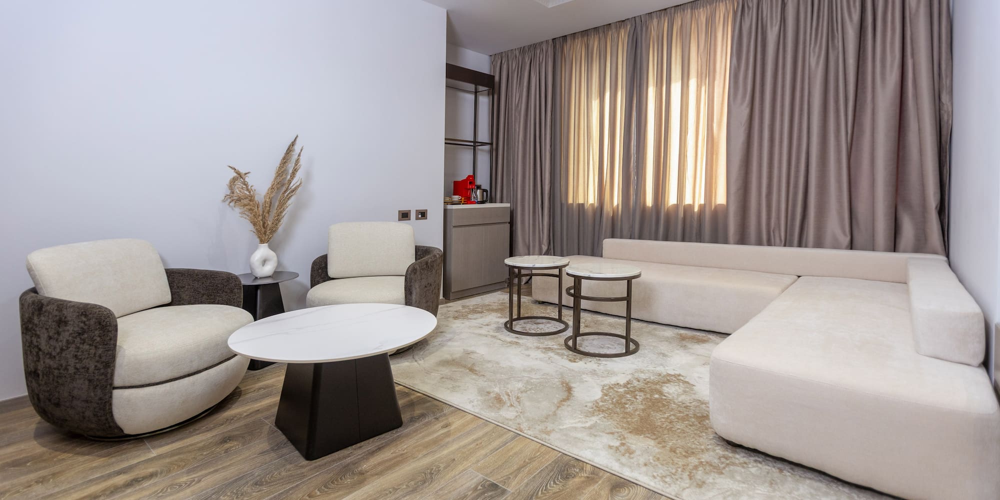 a living room with a couch and chairs