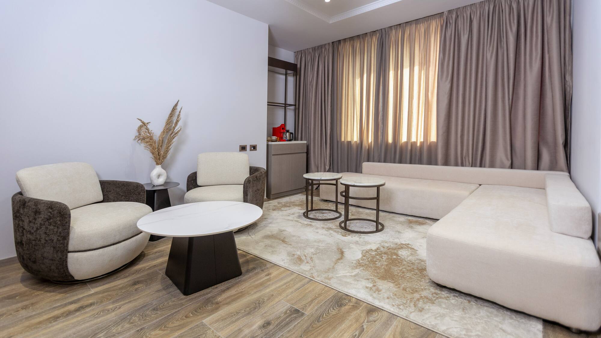 a living room with a couch and chairs