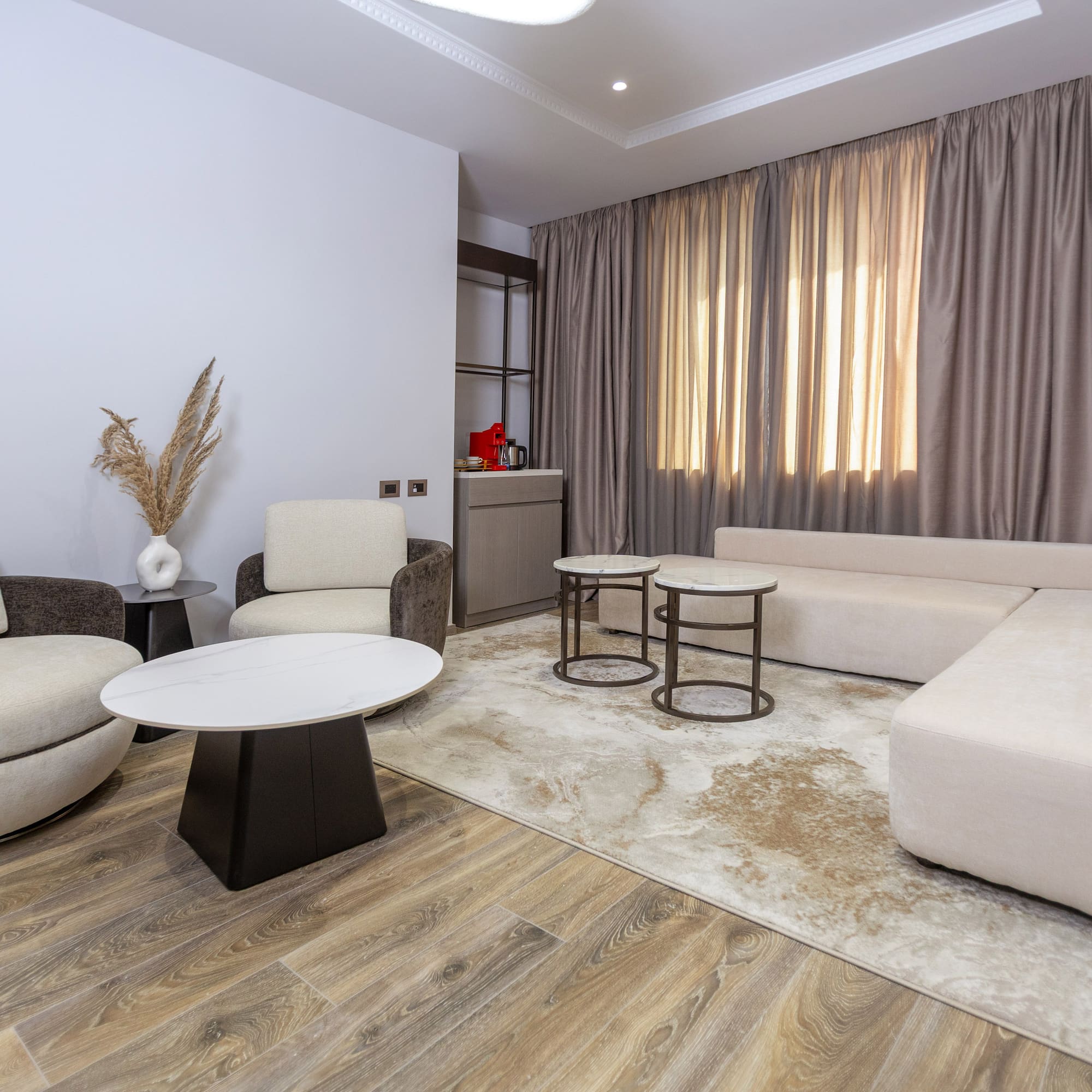 a living room with a couch and chairs