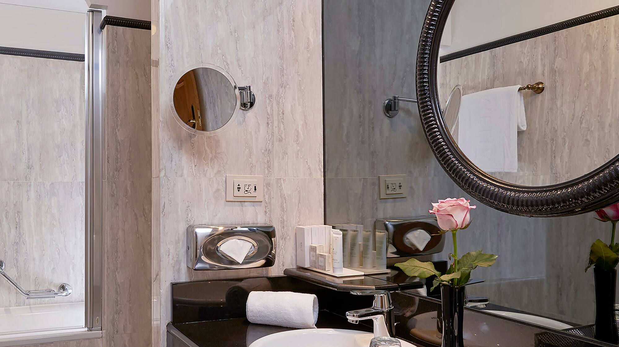 a bathroom with a mirror and sink