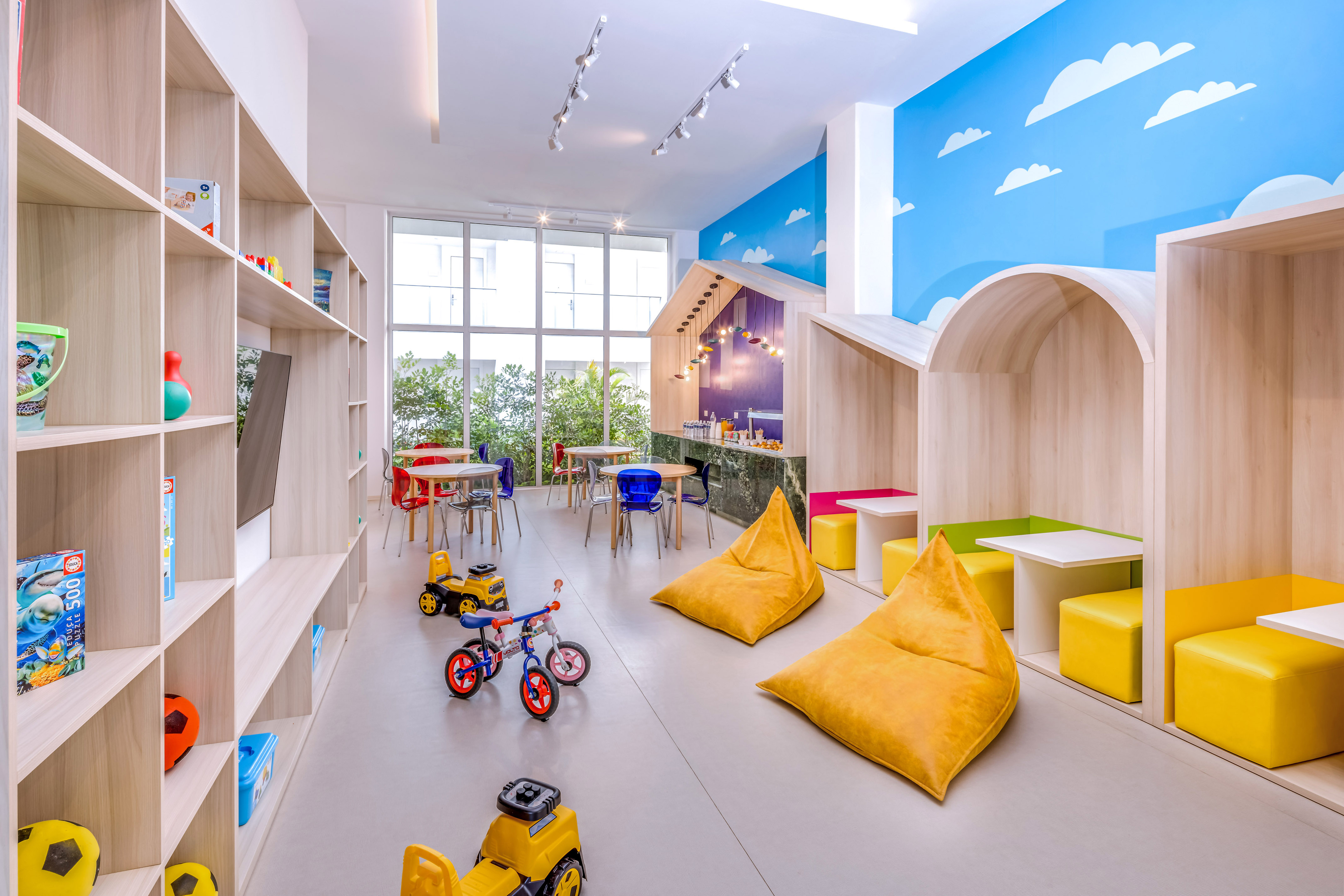 a room with a large group of toys and tables