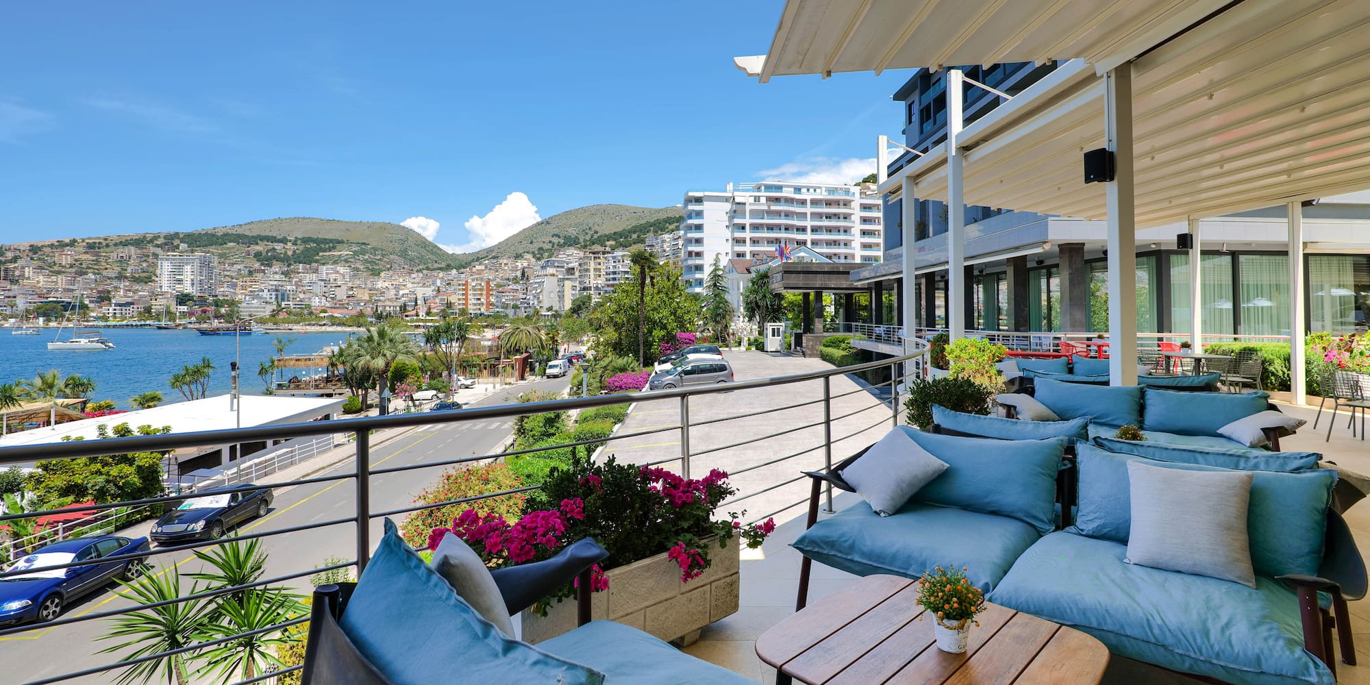 a patio with a view of the city and a road