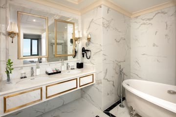 a bathroom with a tub and a mirror