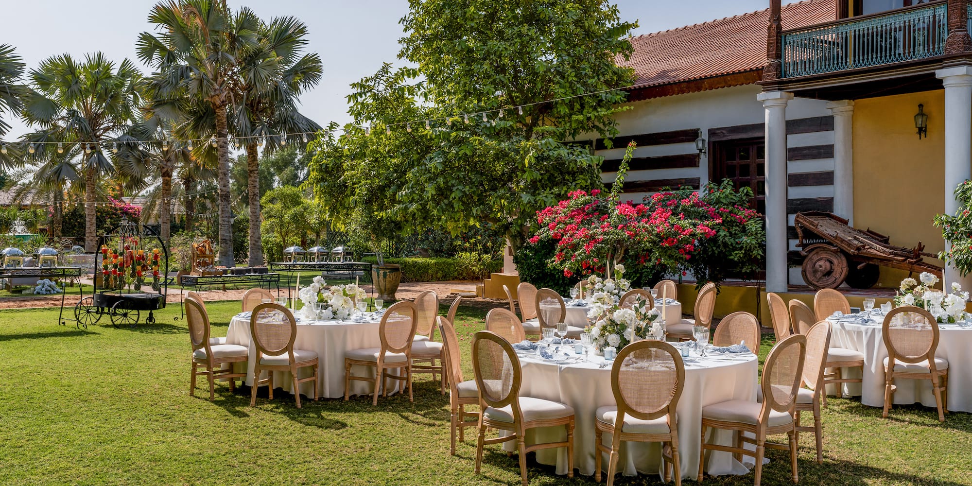 a group of tables set up in a yard