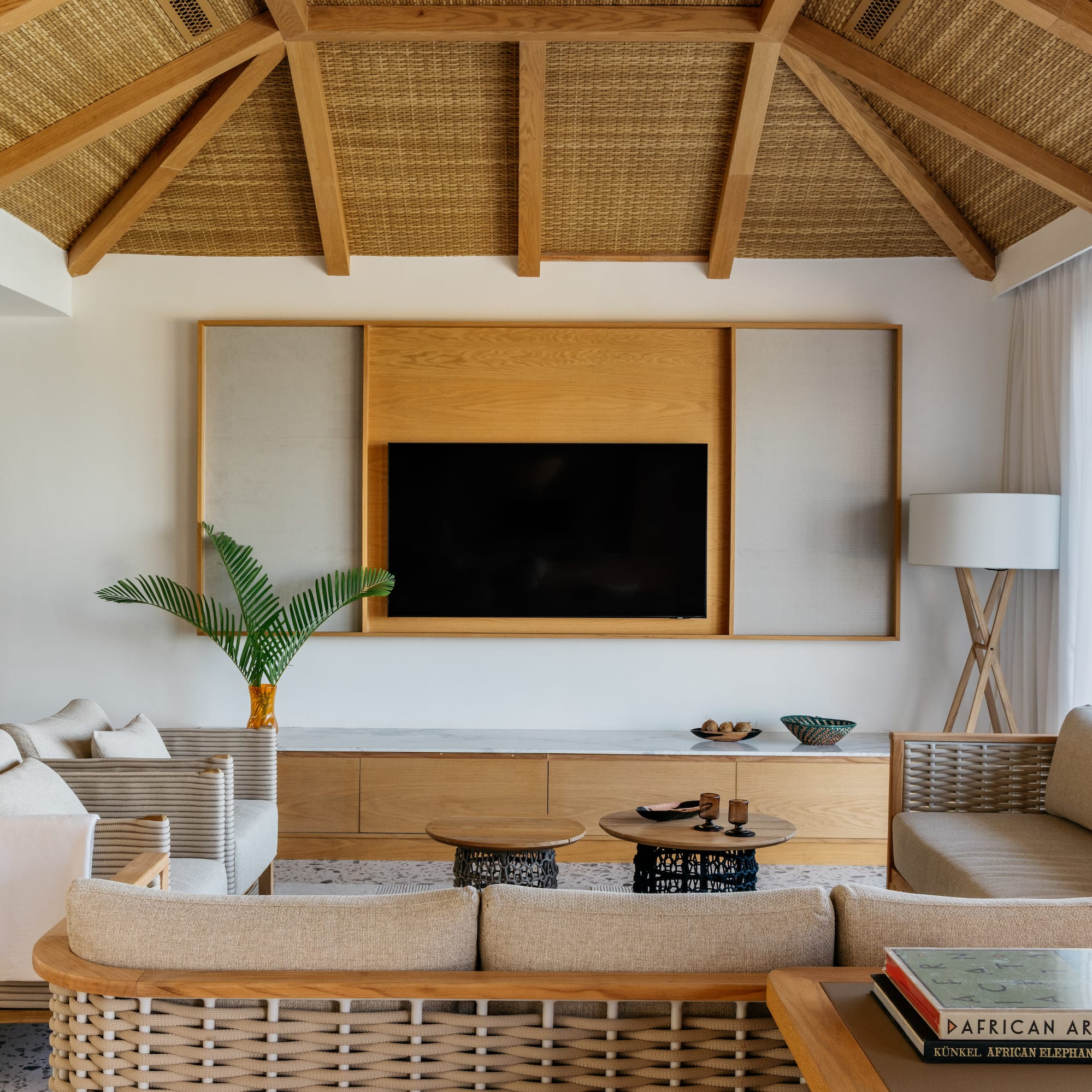 a living room with a television and a couch