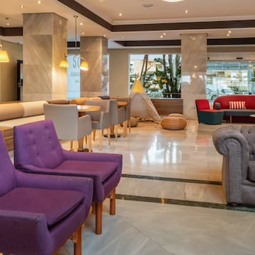 a room with chairs and tables