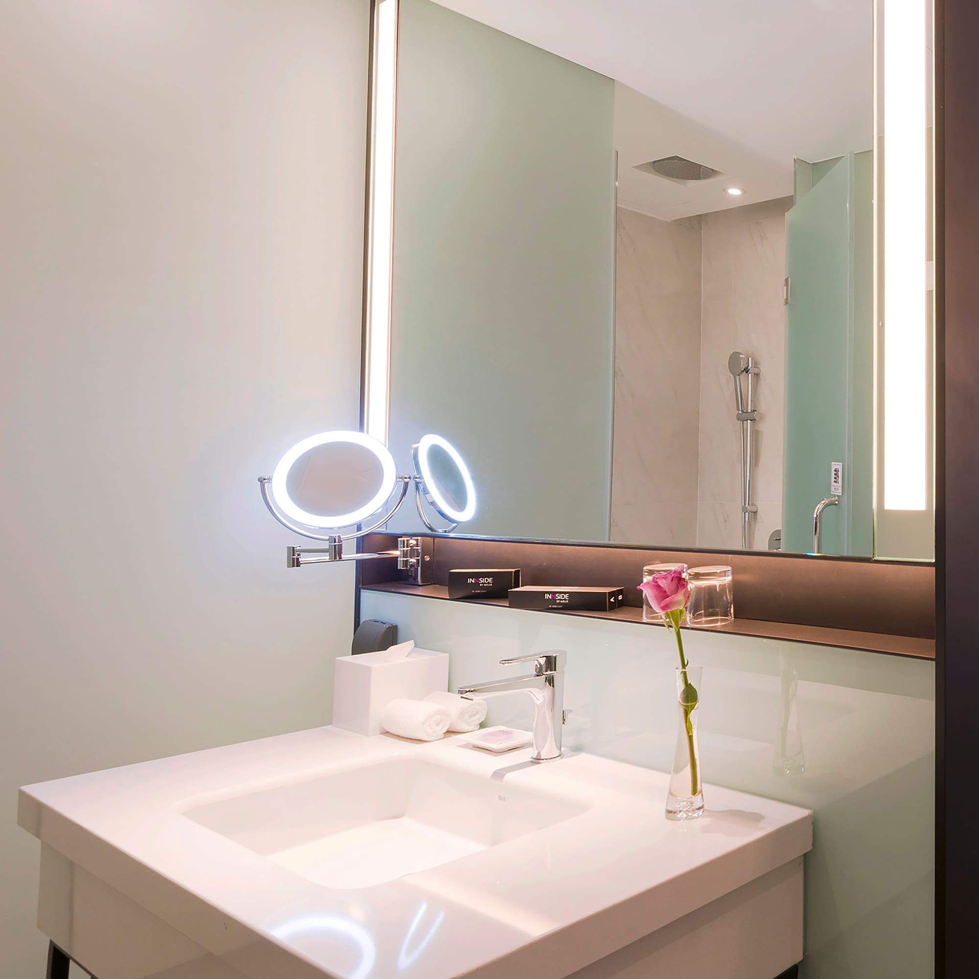 a bathroom with a mirror and sink