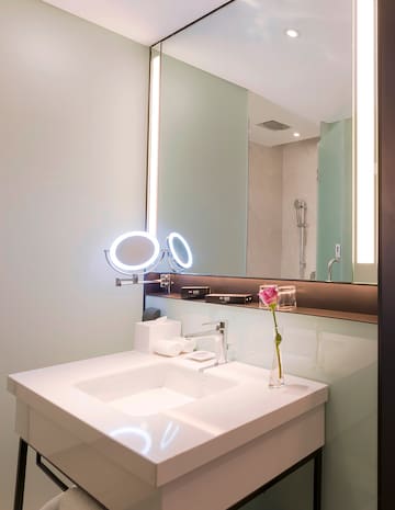 a bathroom with a mirror and sink