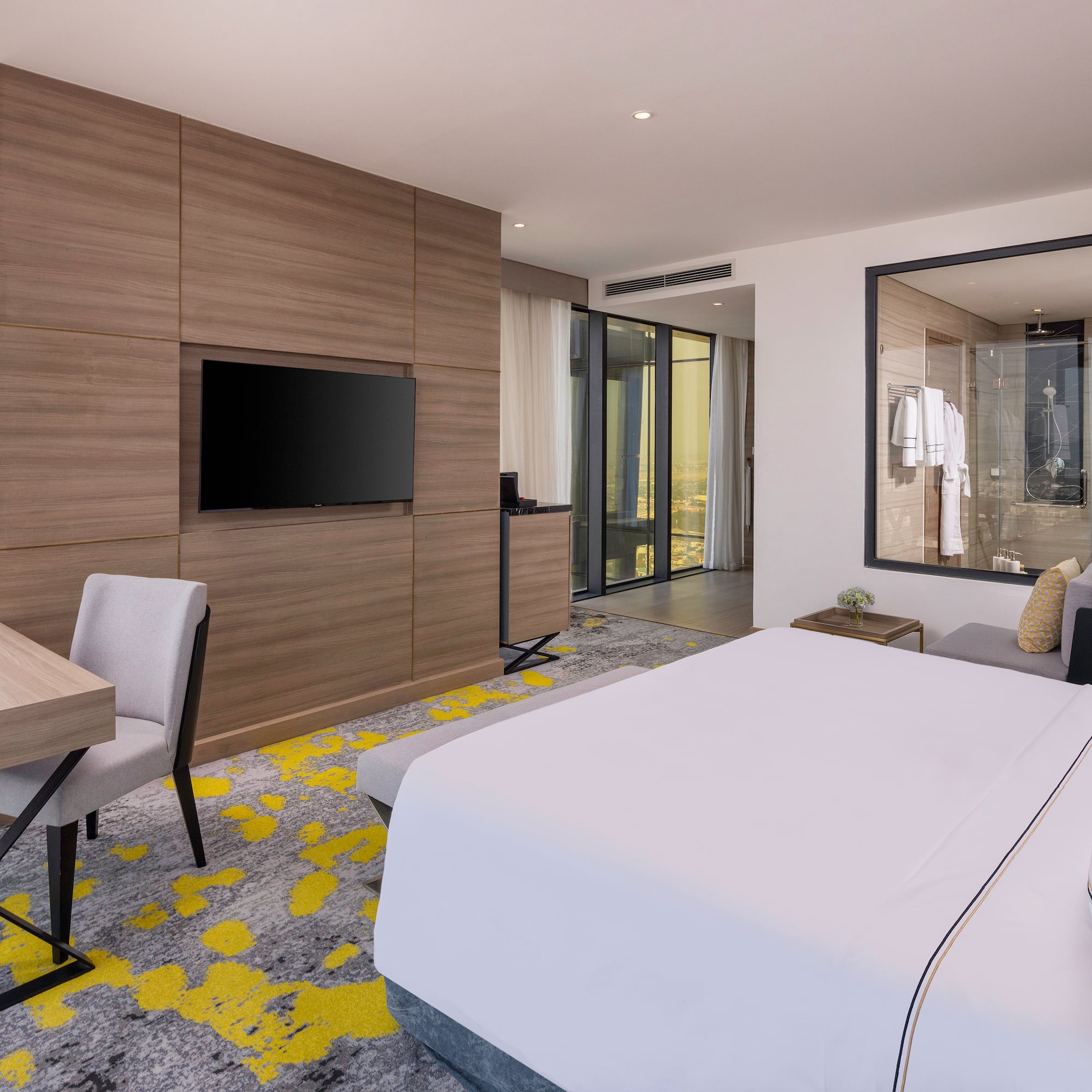 a room with a bed and a tv