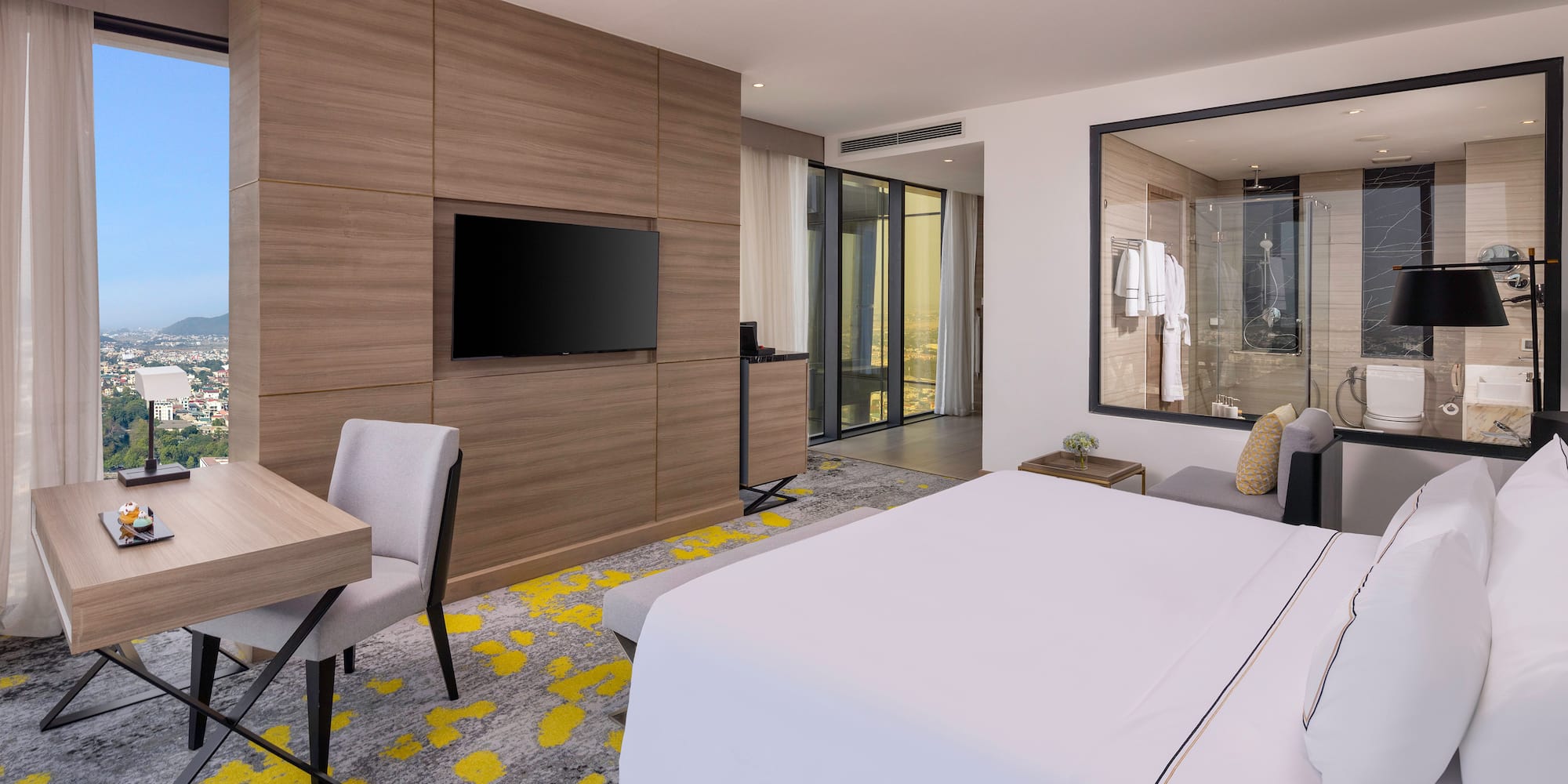 a room with a bed and a tv