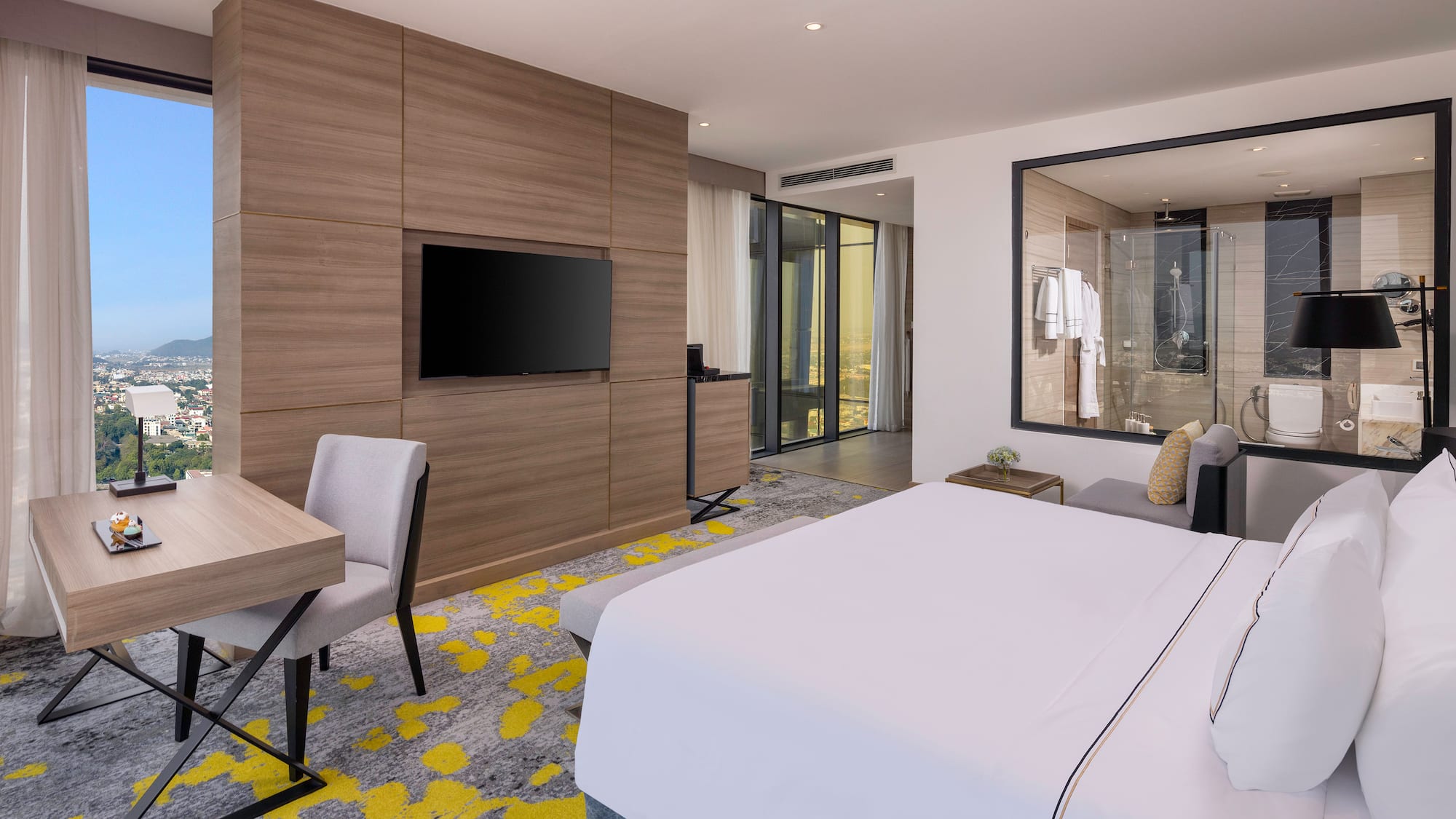 a room with a bed and a tv