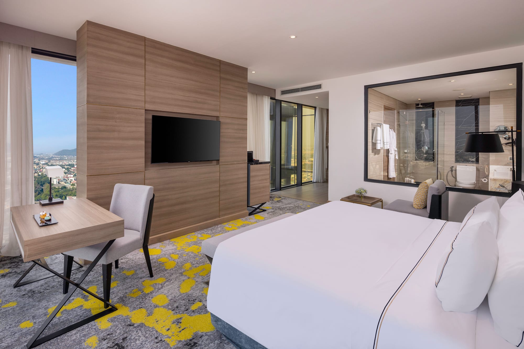 a room with a bed and a tv