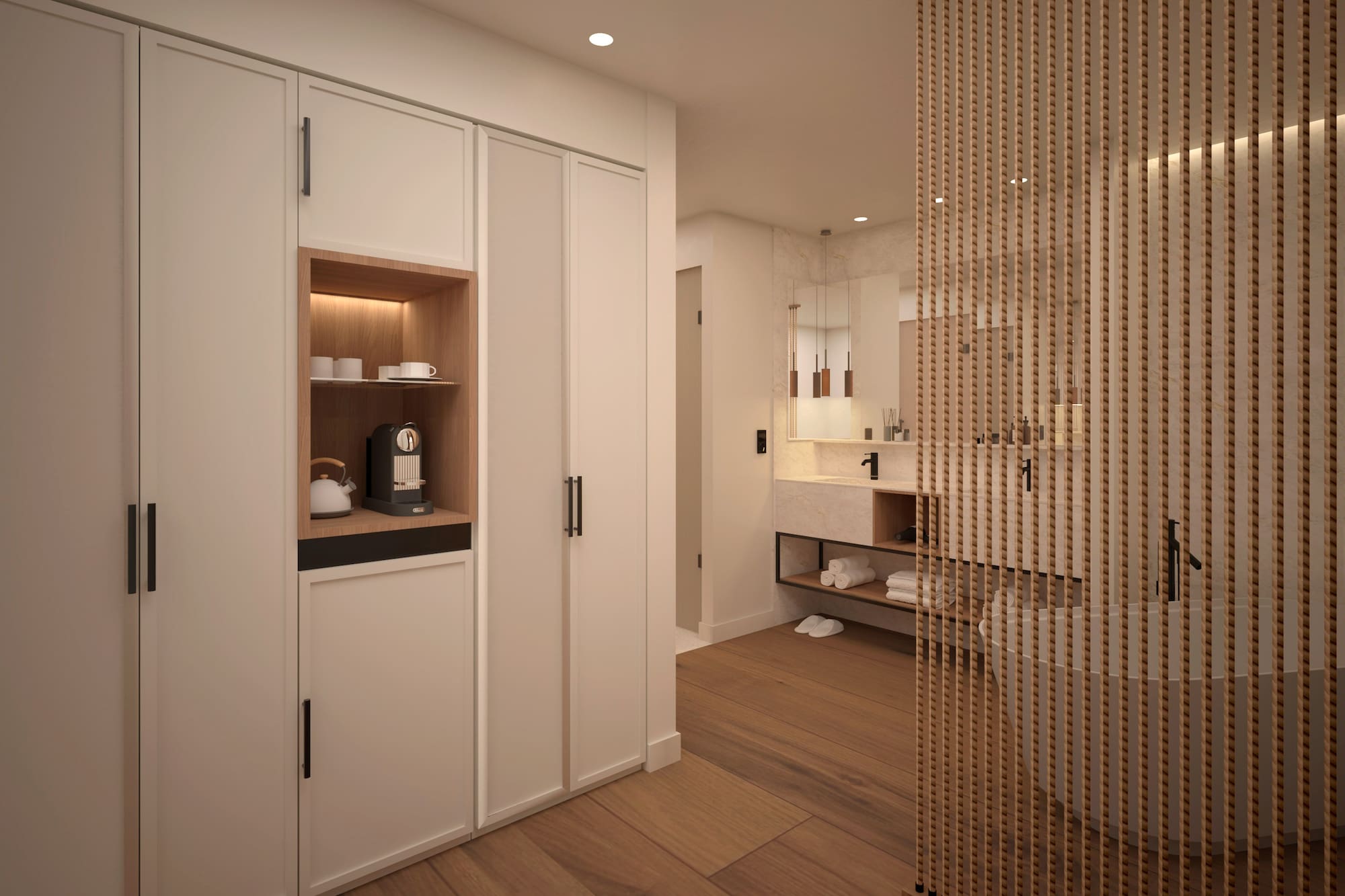 Armarios blancos y barra divisora de madera en un baño moderno. - Suite son Solárium Panorámica - Hotel Golf Santa Ponsa Meliá Collection, Mallorca