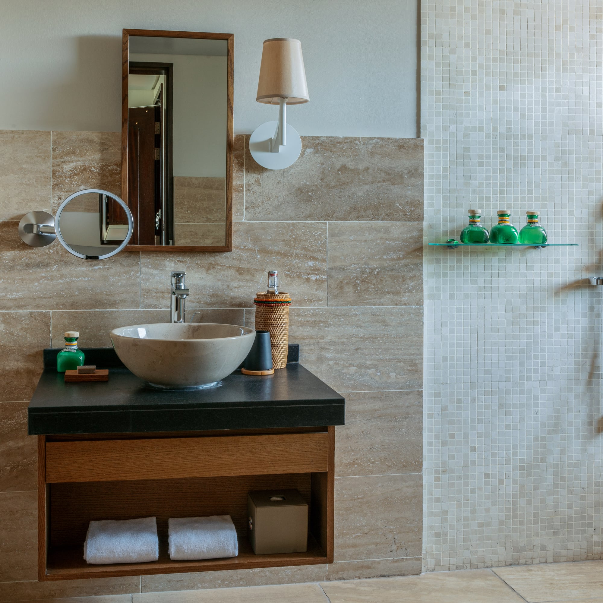 a bathroom with a sink and shower