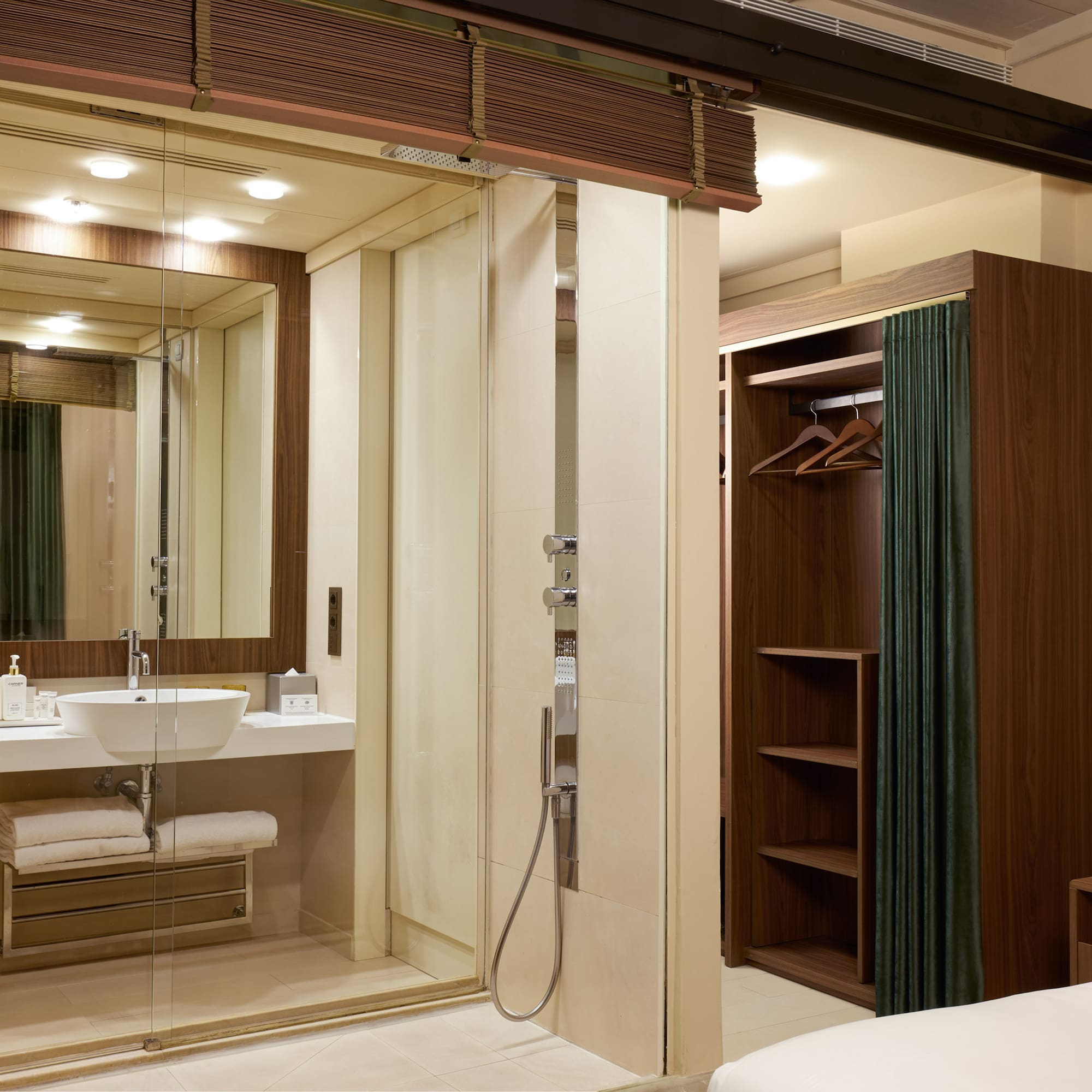 a bathroom with a glass shower door