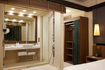 a bathroom with a glass shower door