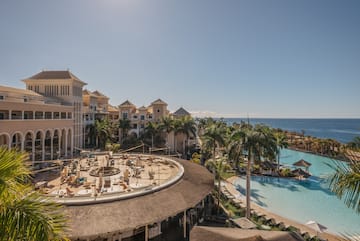 a pool and buildings with a large body of water