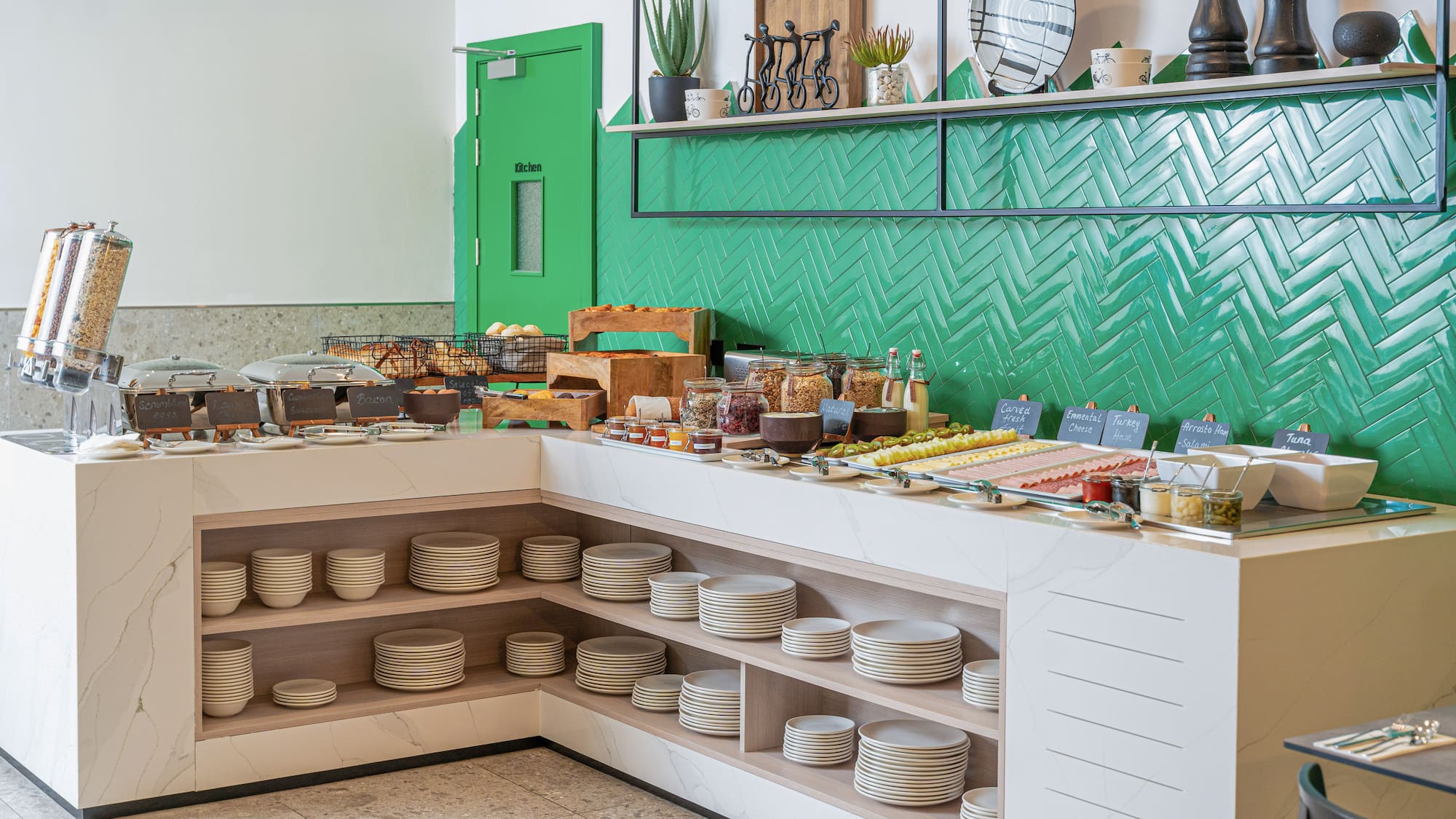a buffet with plates and food on shelves