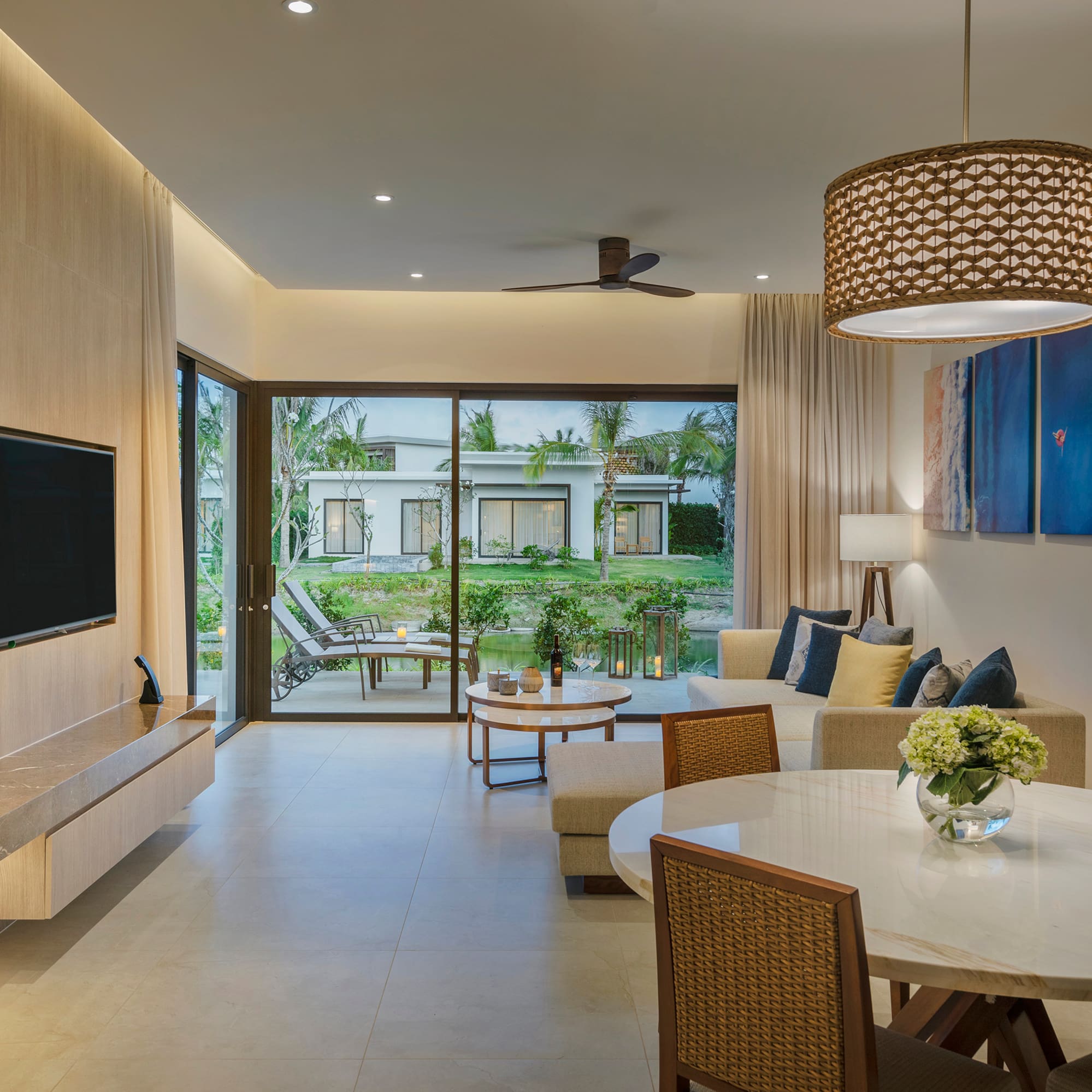 a living room with a television and a table